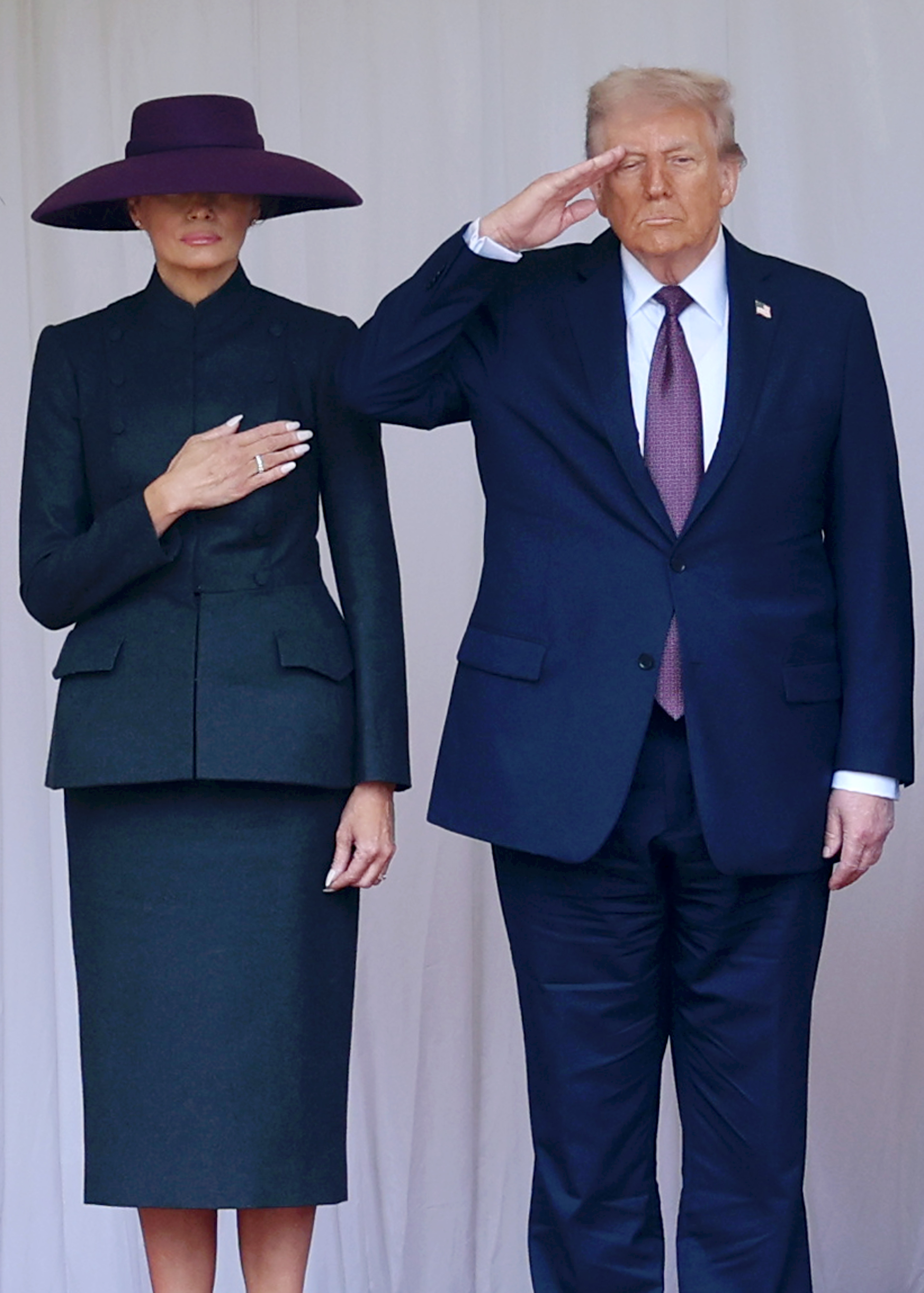 U.S. President Donald Trump and First Lady Melania take the anthem during the State visit at Windsor Castle in England on September 17, 2025 | Source: Getty Images