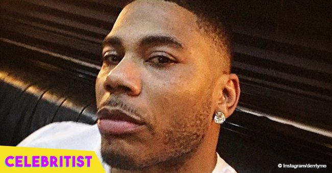 Nelly shares photo with his longtime girlfriend in see-through black dress