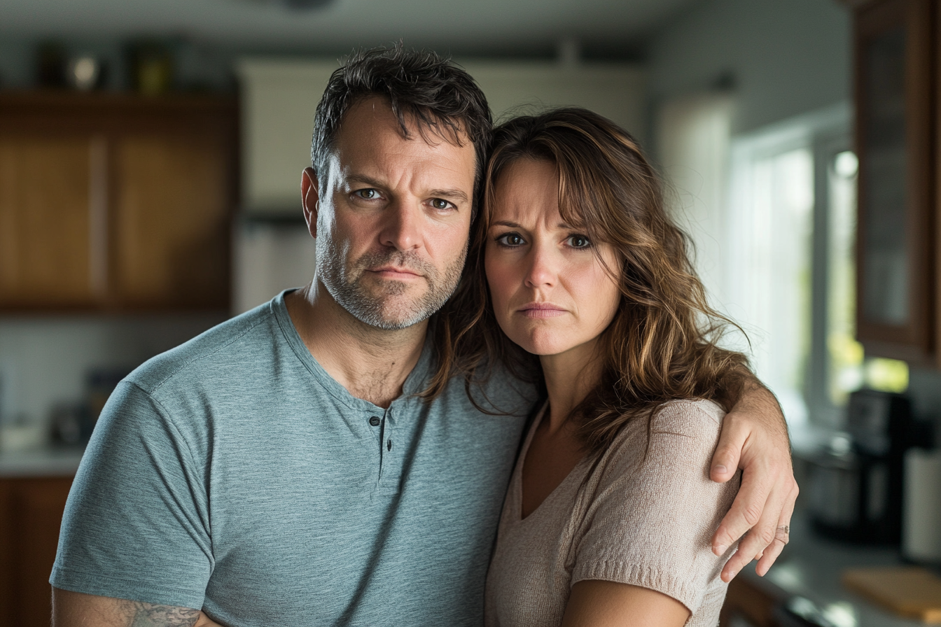 A couple standing in their kitchen | Source: Midjourney