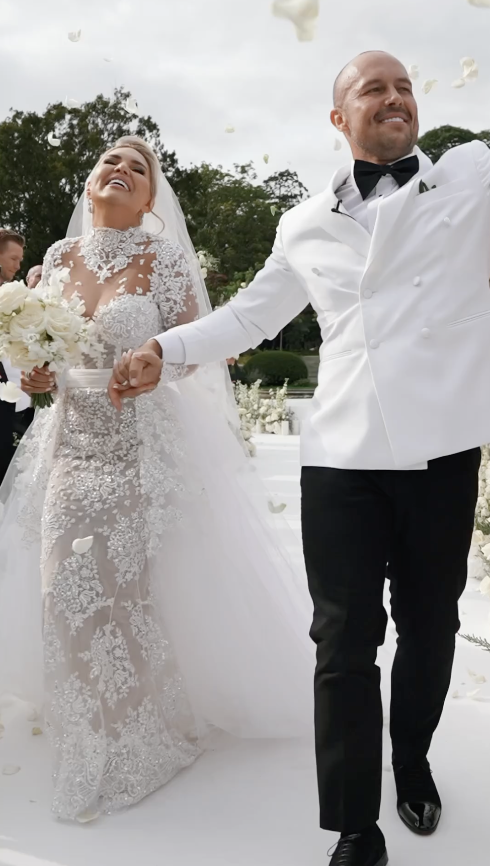 Erin McGregor beams as Terry Kavanagh waves to the crowd, both expressing their happiness on their wedding day, August 17, 2024 | Source: Instagram/odicci_films