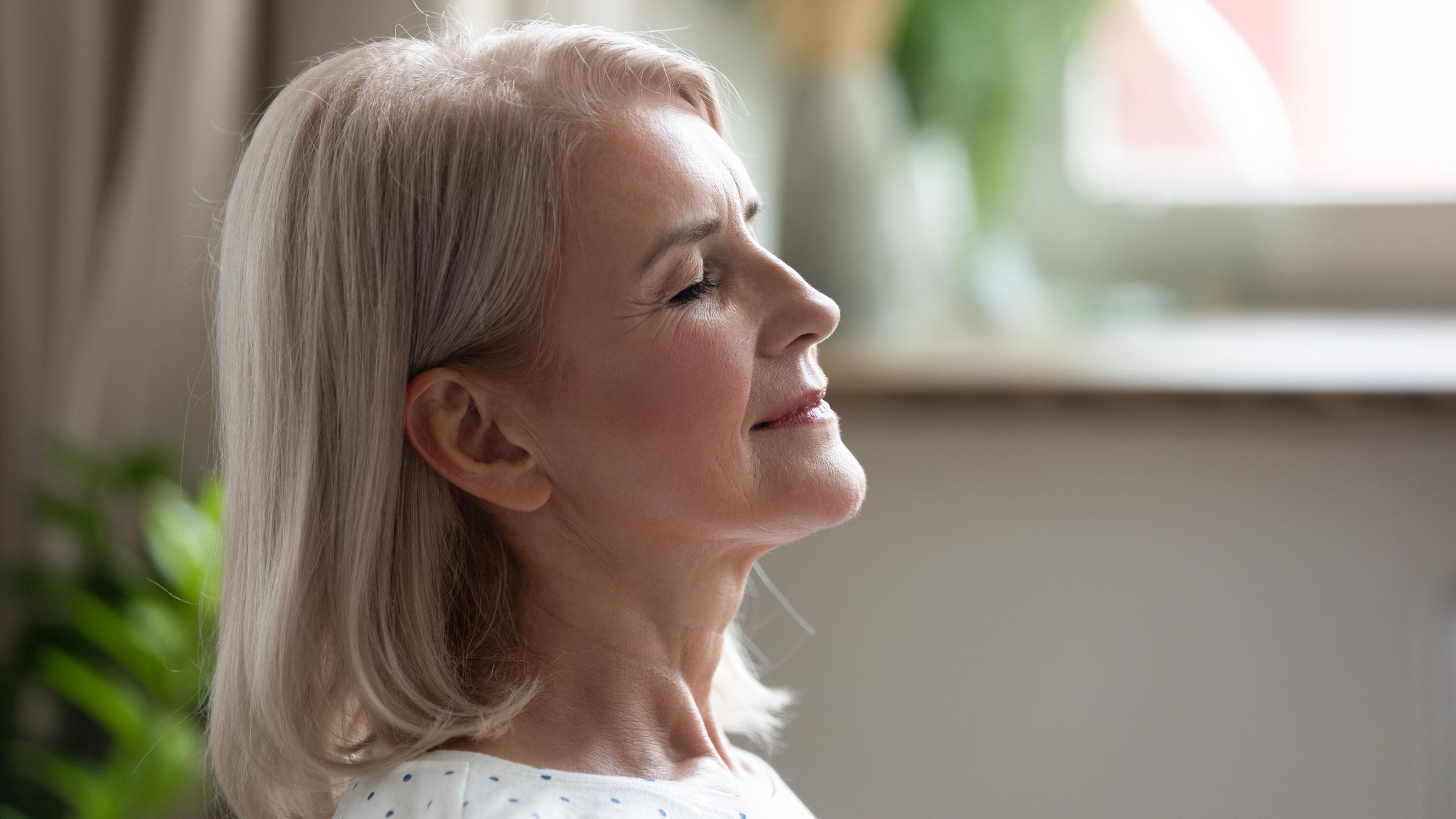 A woman taking a moment to breathe | Source: Shutterstock