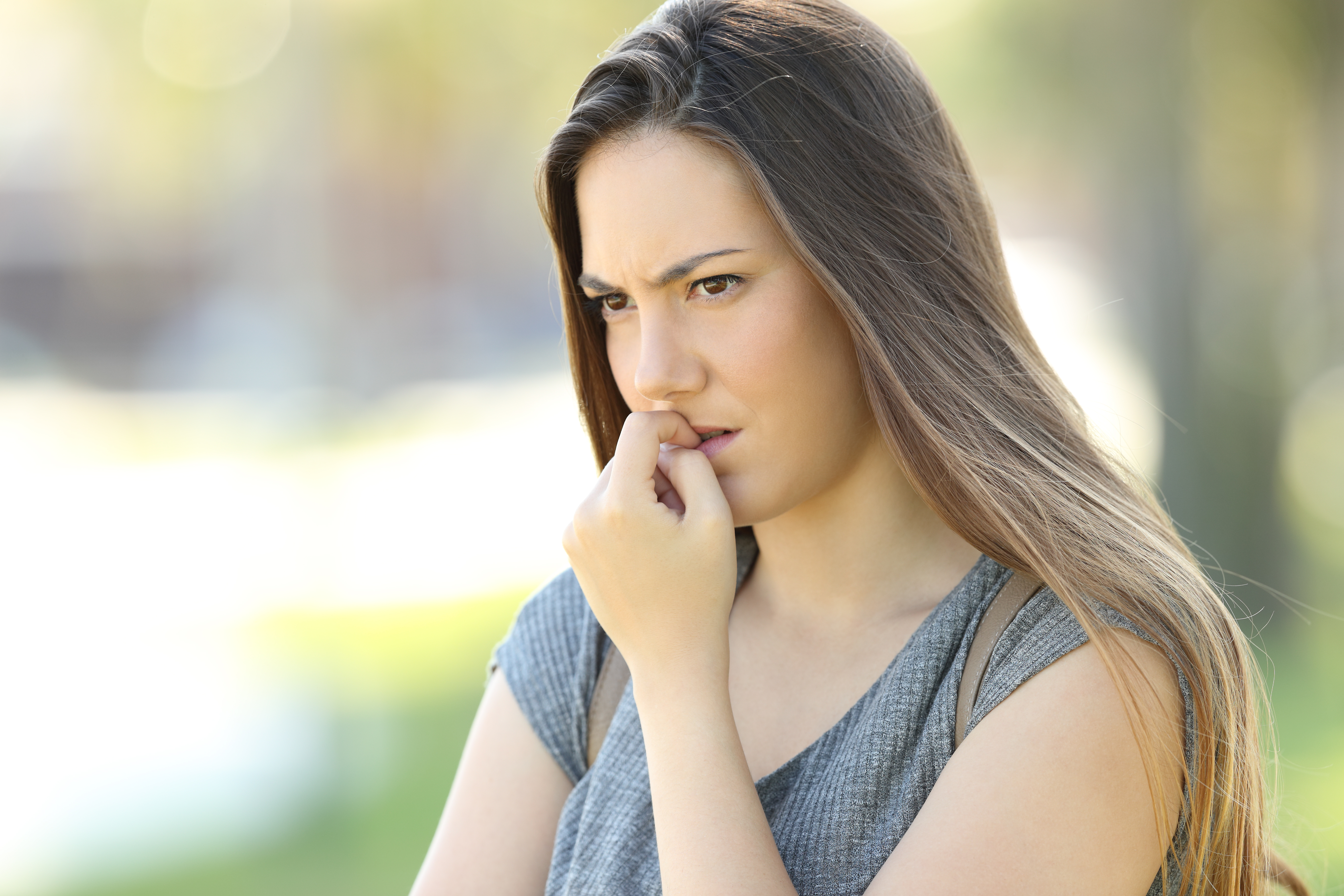 A young woman looking worried | Source: Shutterstock