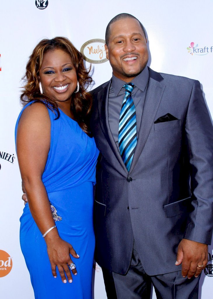 Pat and Gina at the grand opening of Nelly's Barbecue Parlor on July 12, 2011 in New York | Source: Getty Images