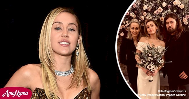 Miley Cyrus poses with proud parents in sweet wedding photo looking like a carbon copy of her mom