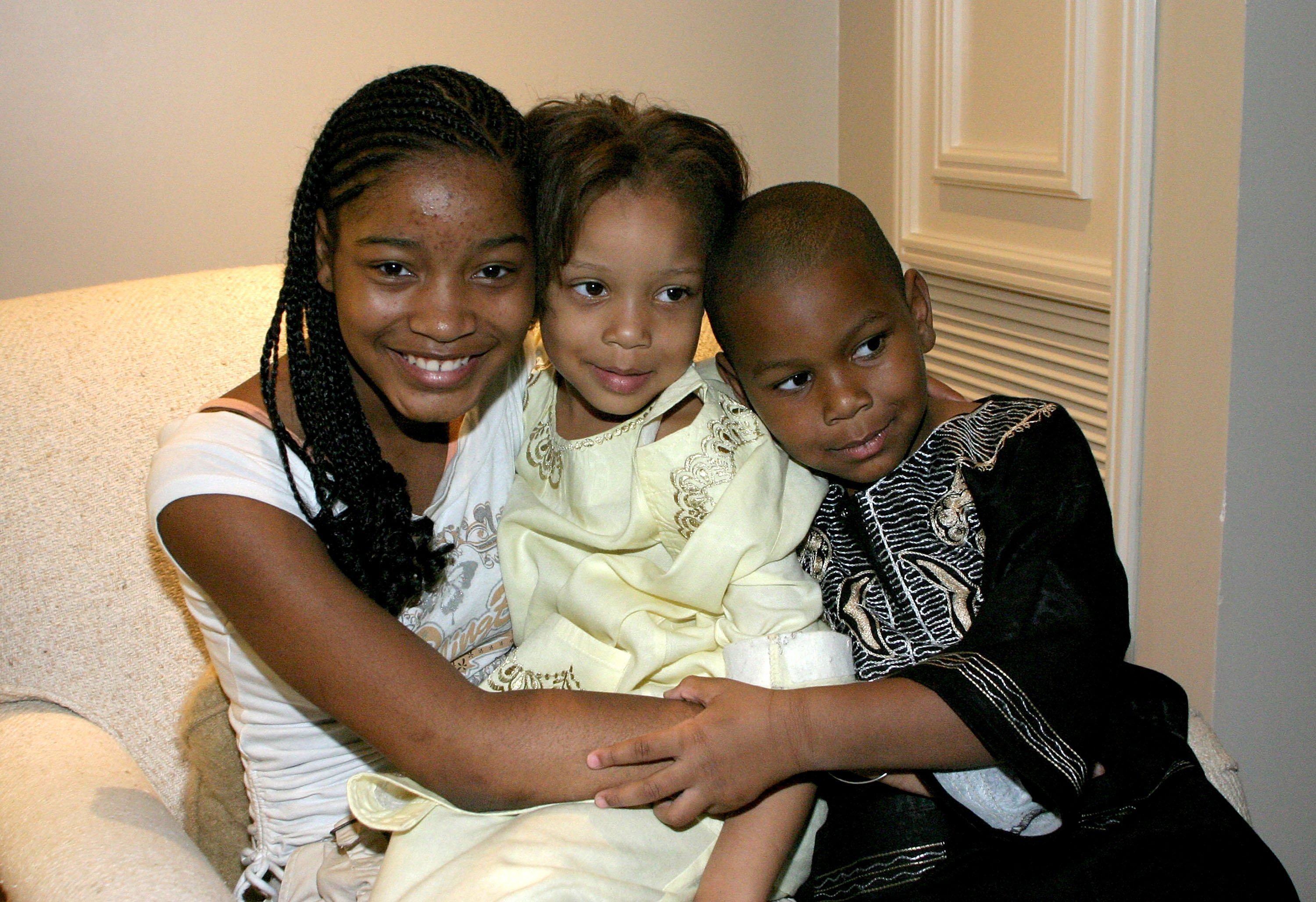 Keke Palmer with her twin siblings Lawrencia and Lawrence Palmer at Lions Gate Films' cocktail reception for the film "Akeelah and the Bee" during ShoWest on March 14, 2006, in Las Vegas, Nevada | Sources: Getty Images