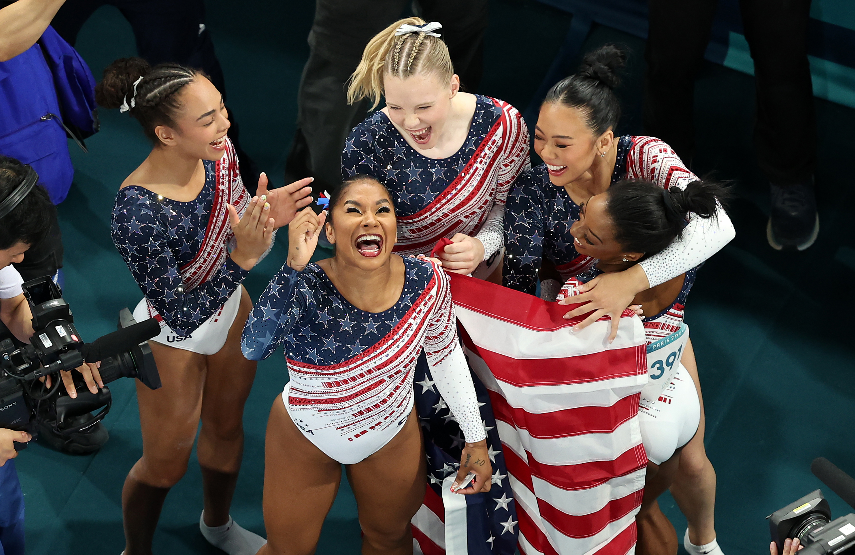 Hezly Rivera, Jordan Chiles, Jade Carey, Sunisa Lee, and Simone Biles celebrate during the Women’s Team Final at the Paris 2024 Olympics on July 30, 2024 | Source: Getty Images