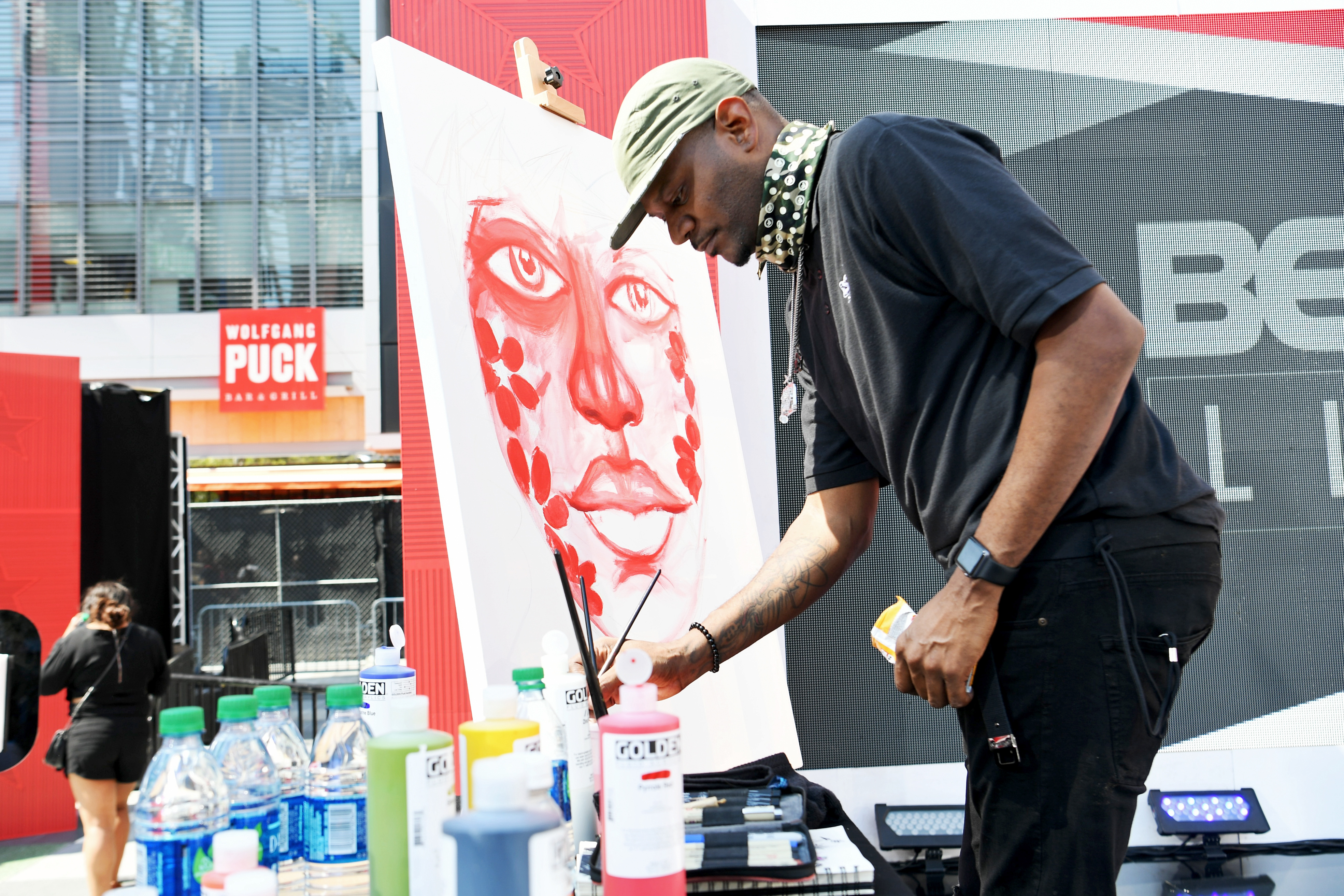 Tuki Carter paints onstage on Day Two of the 2017 BETX Live! event at Gilbert Lindsey Plaza on June 23 in Los Angeles, California. | Source: Getty Images