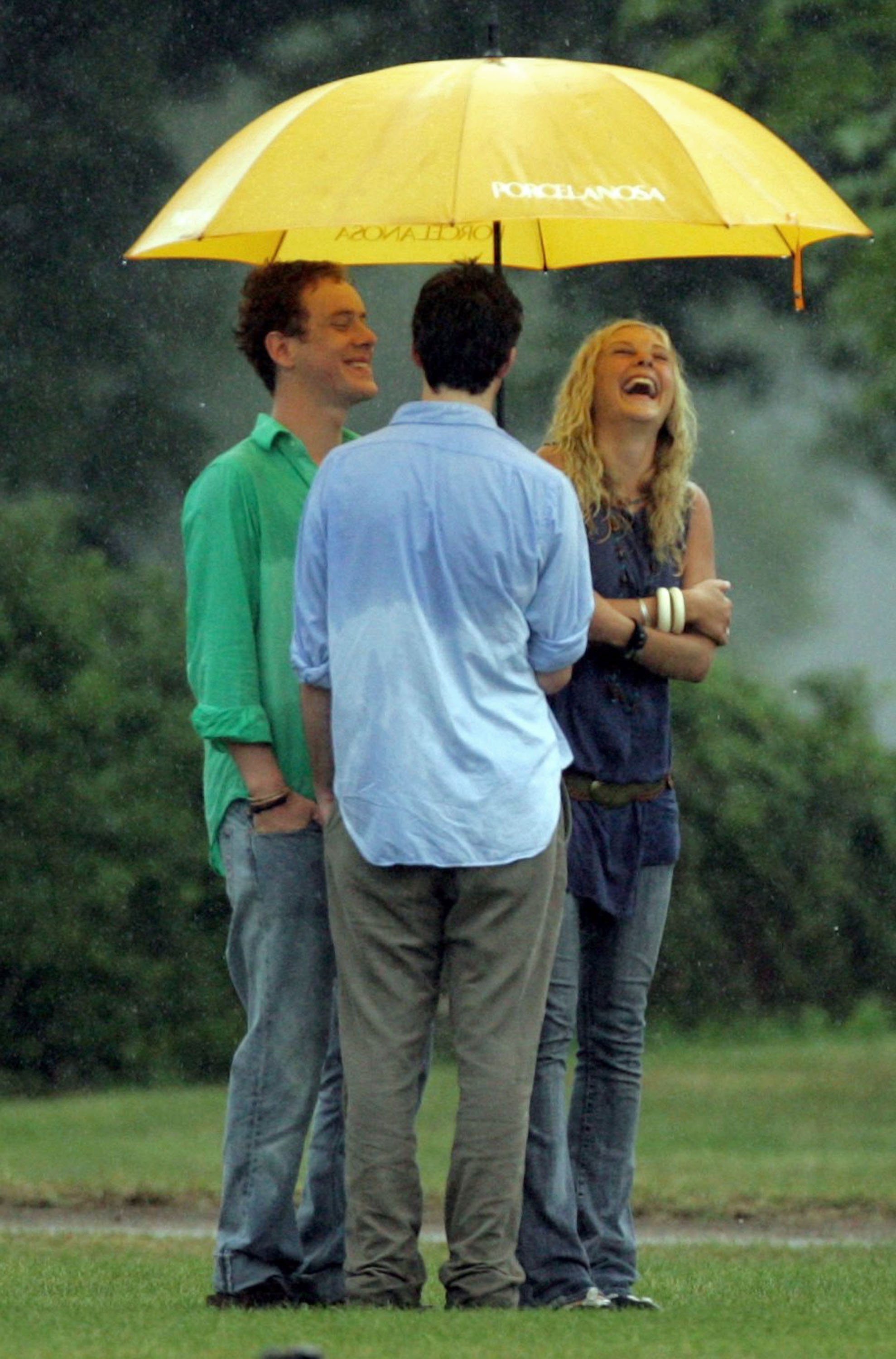 Prince Harry's former girlfriend Chelsy Davy pictured laughing with Prince Harry's friends Guy Pelly (L) and James Murray Wells (C) during the polo day at Cirencester Park Polo Club on July 22, 2006 in Cirencester, England. | Source: Getty Images