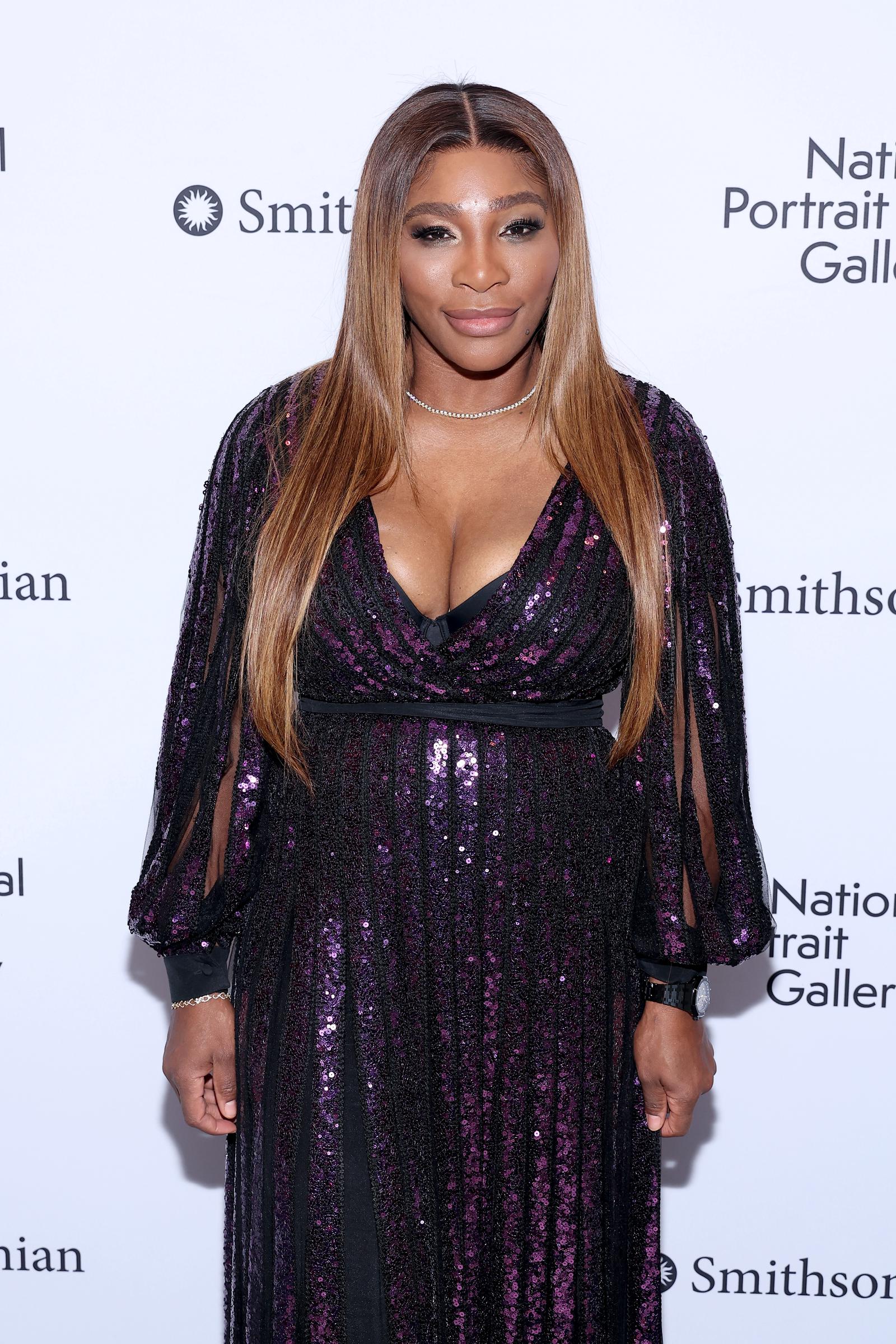 Serena Williams attended the Portrait of a Nation Gala in November 2022, in Washington, D.C., wearing a sleek shimmering gown with long sleeves. Her hair was styled in soft waves, and she smiled gracefully for the camera.