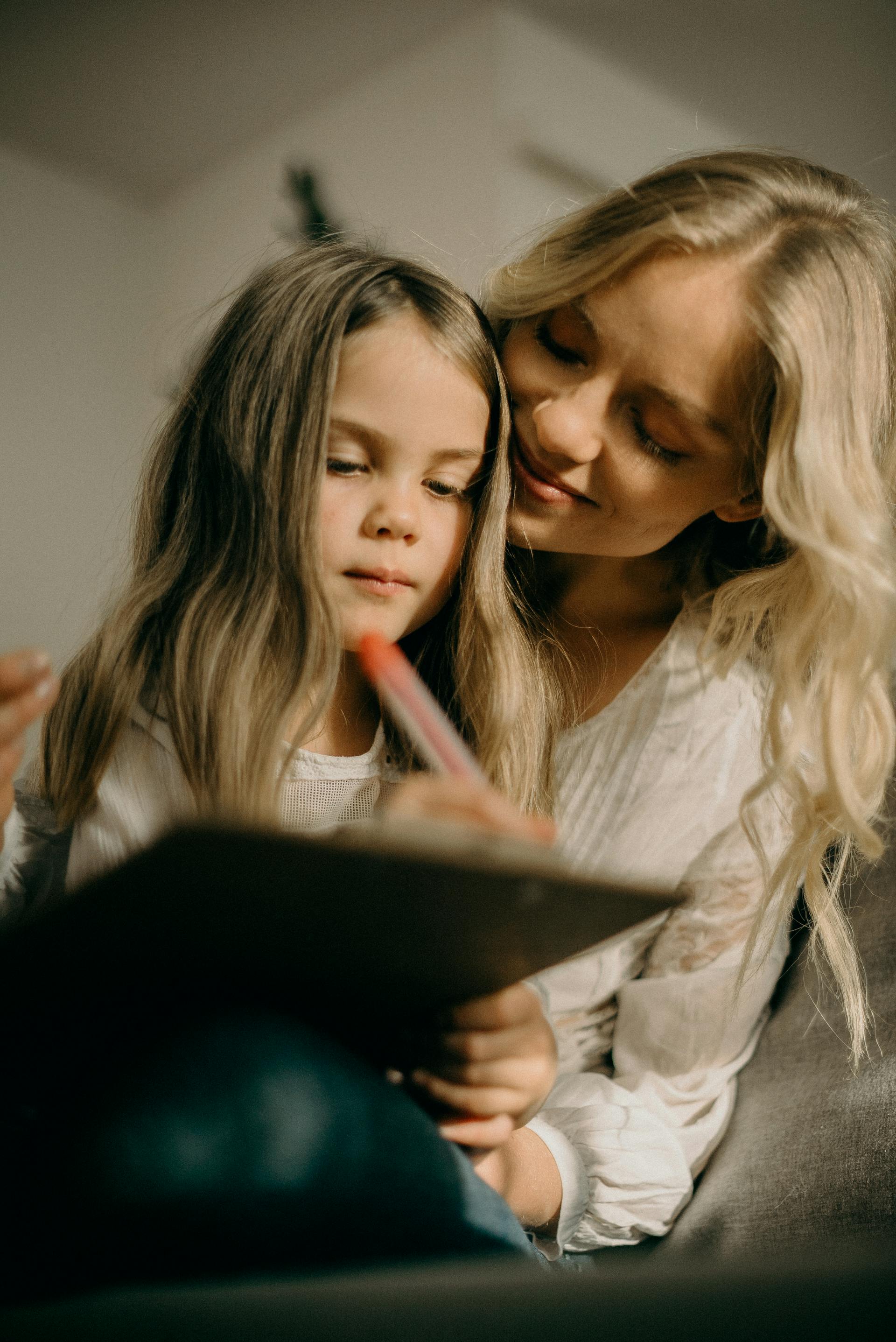 Sad little girl with her mother | Source: Pexels