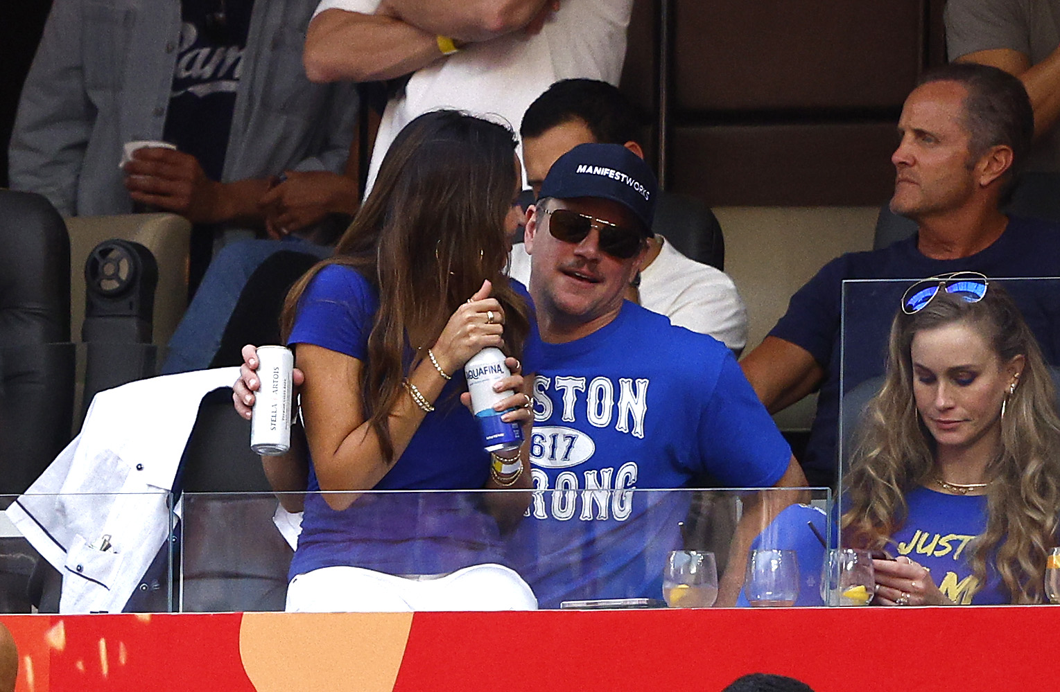 Matt Damon and Luciana Damon share a private moment while attending a sporting event, offering a rare glimpse into their life away from movie premieres. | Source: Getty Images