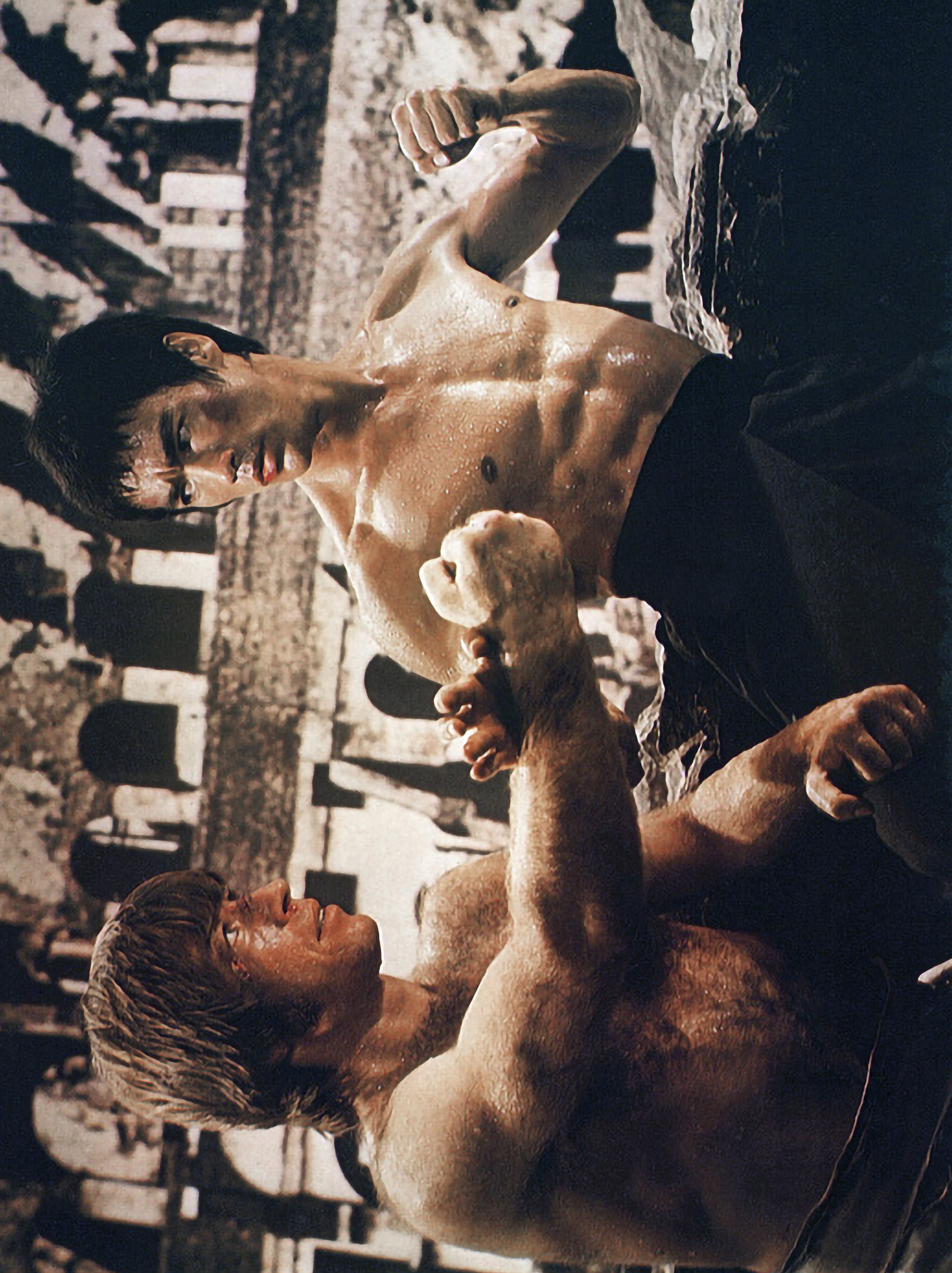 Bruce Lee and Chuck Norris face off in a martial arts stance in "The Way of the Dragon" in 1972. | Source: Getty Images