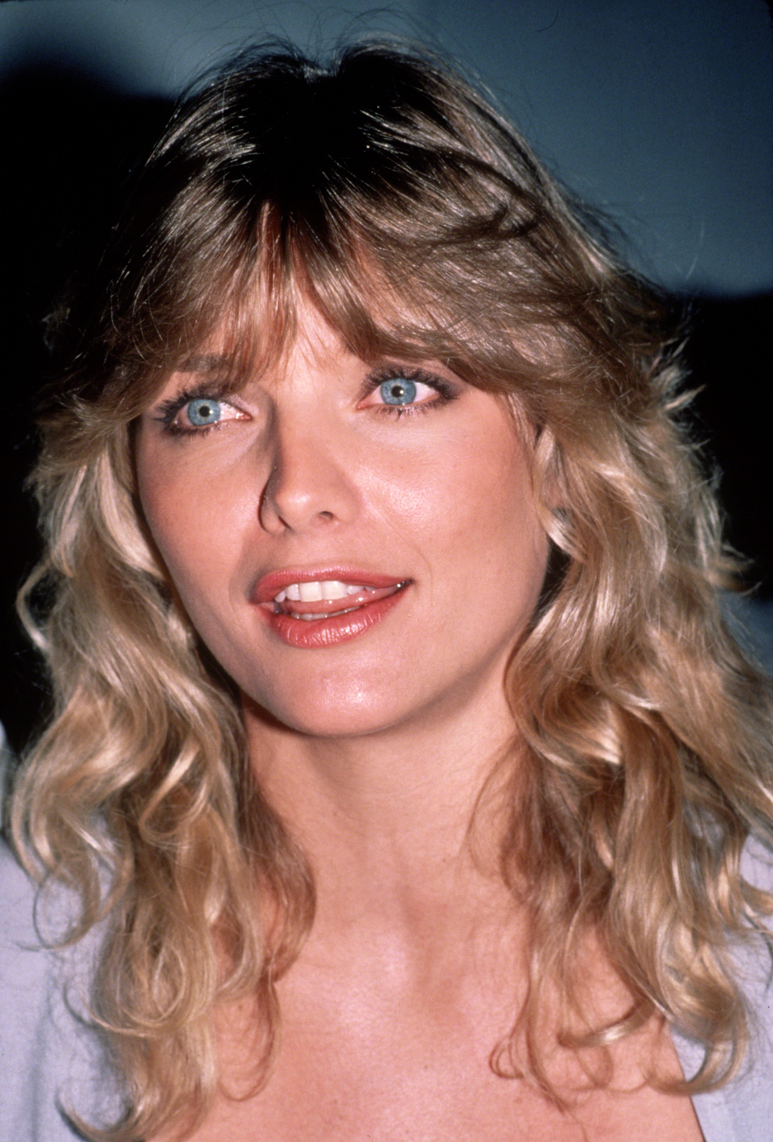 Michelle Pfeiffer posing for a photo in New York City, circa 1982 | Source: Getty Images