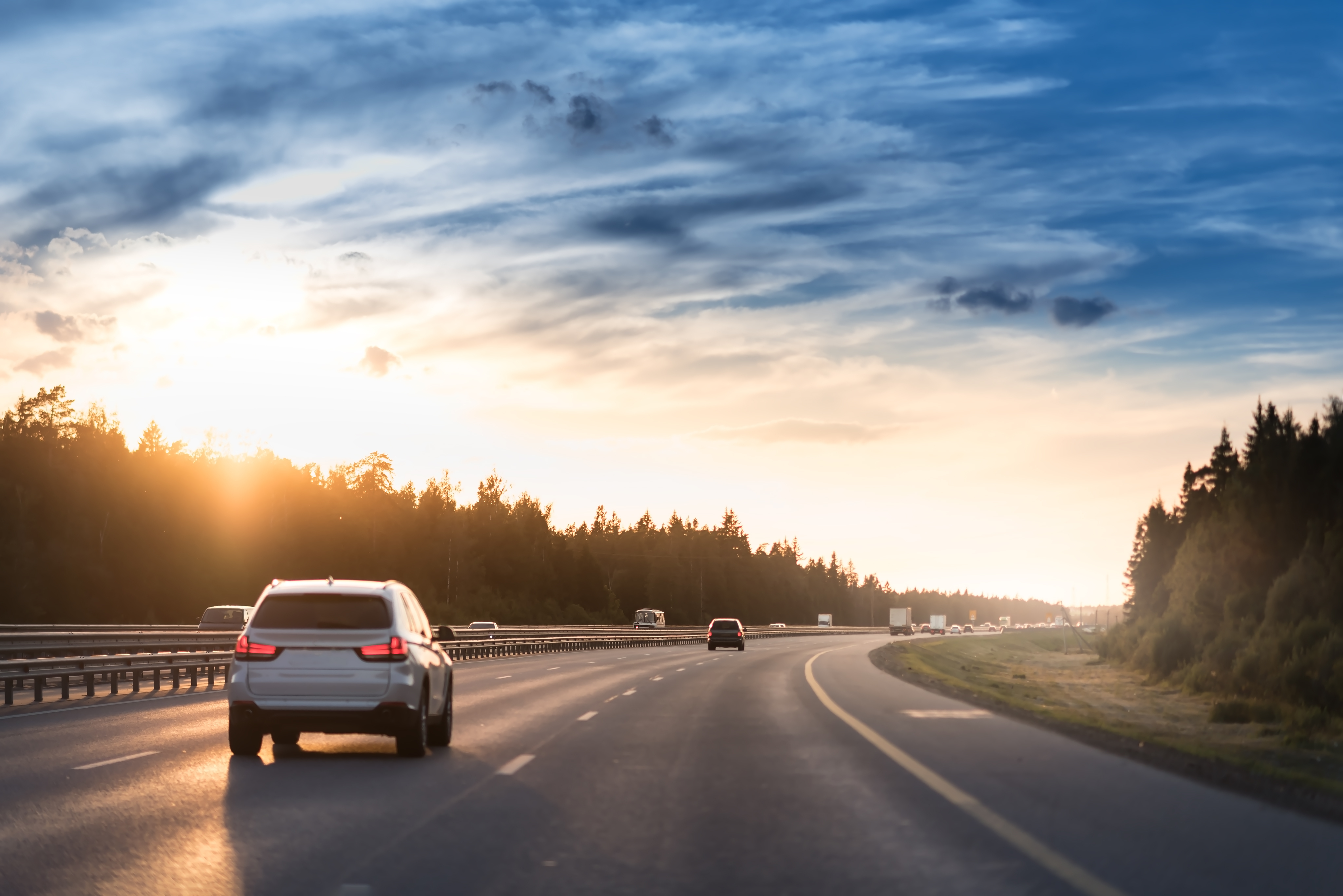 Highway traffic in sunset. | Source: Shutterstock