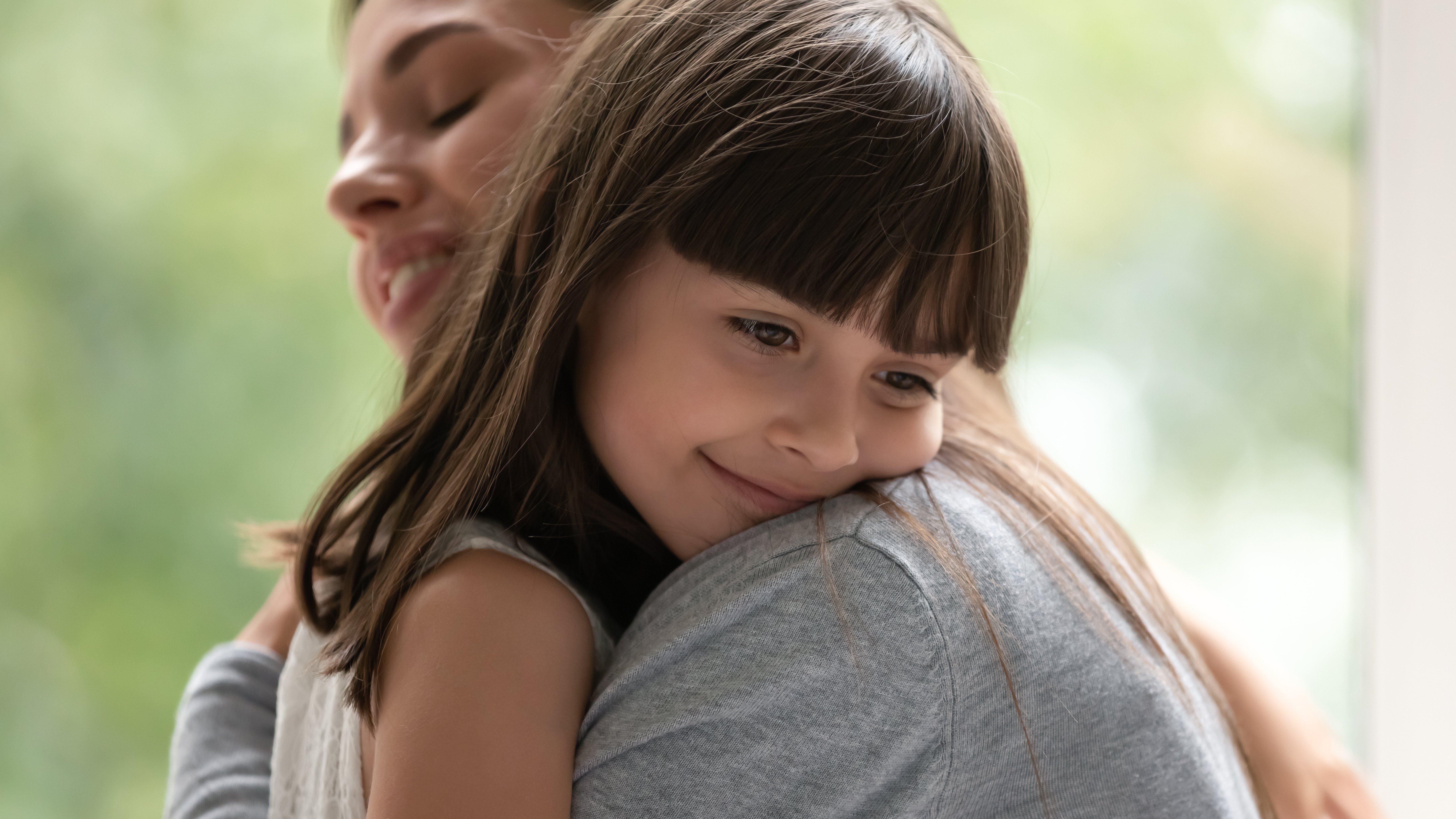 A woman adopting a little girl | Source: Shutterstock