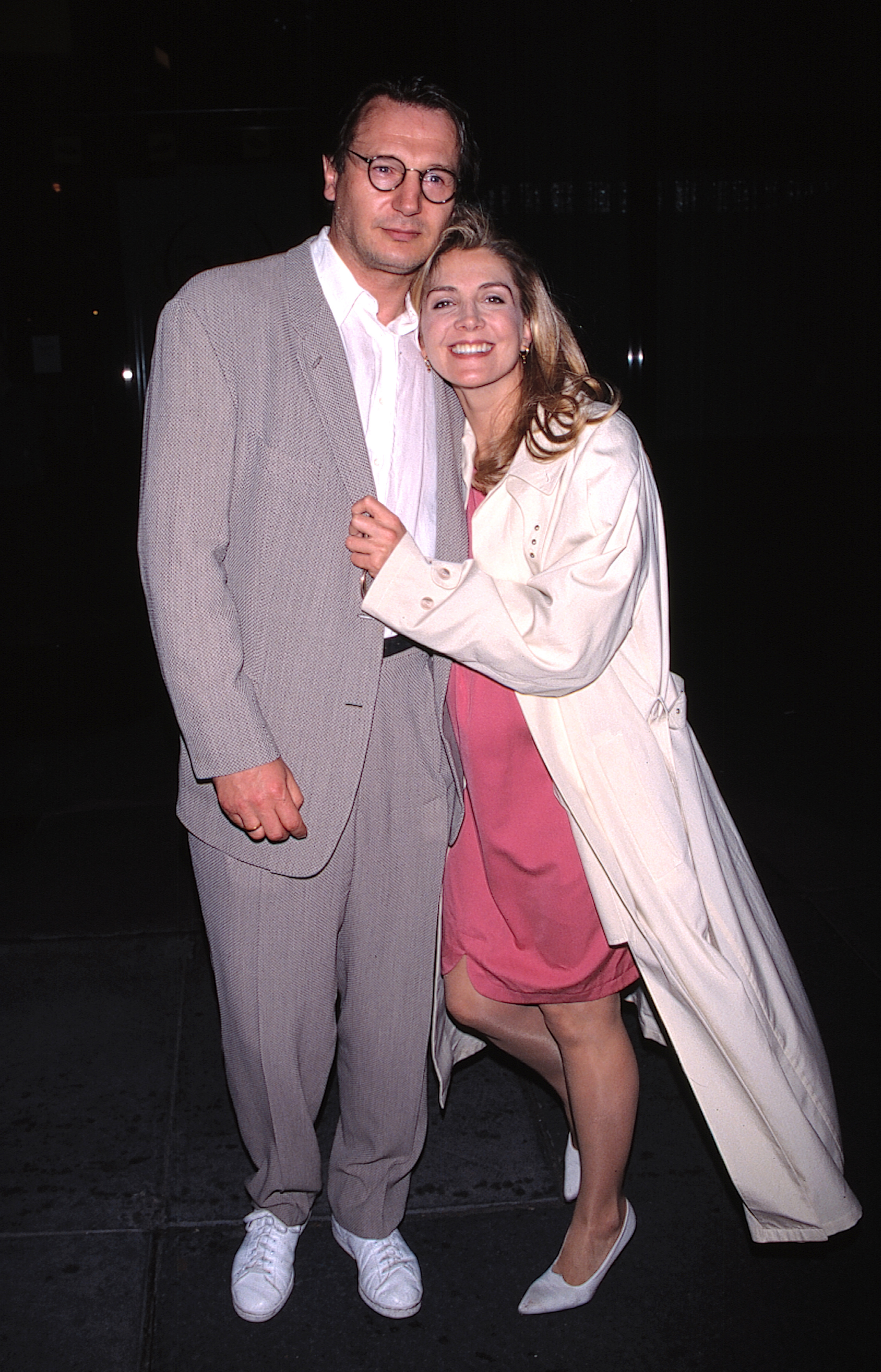Natasha Richardson embraces Liam Neeson with a cheerful smile outside Ostería Del Circo Restaurant in New York City in April 1996. The couple attended a buffet event honoring Almeida Theatre during this outing.