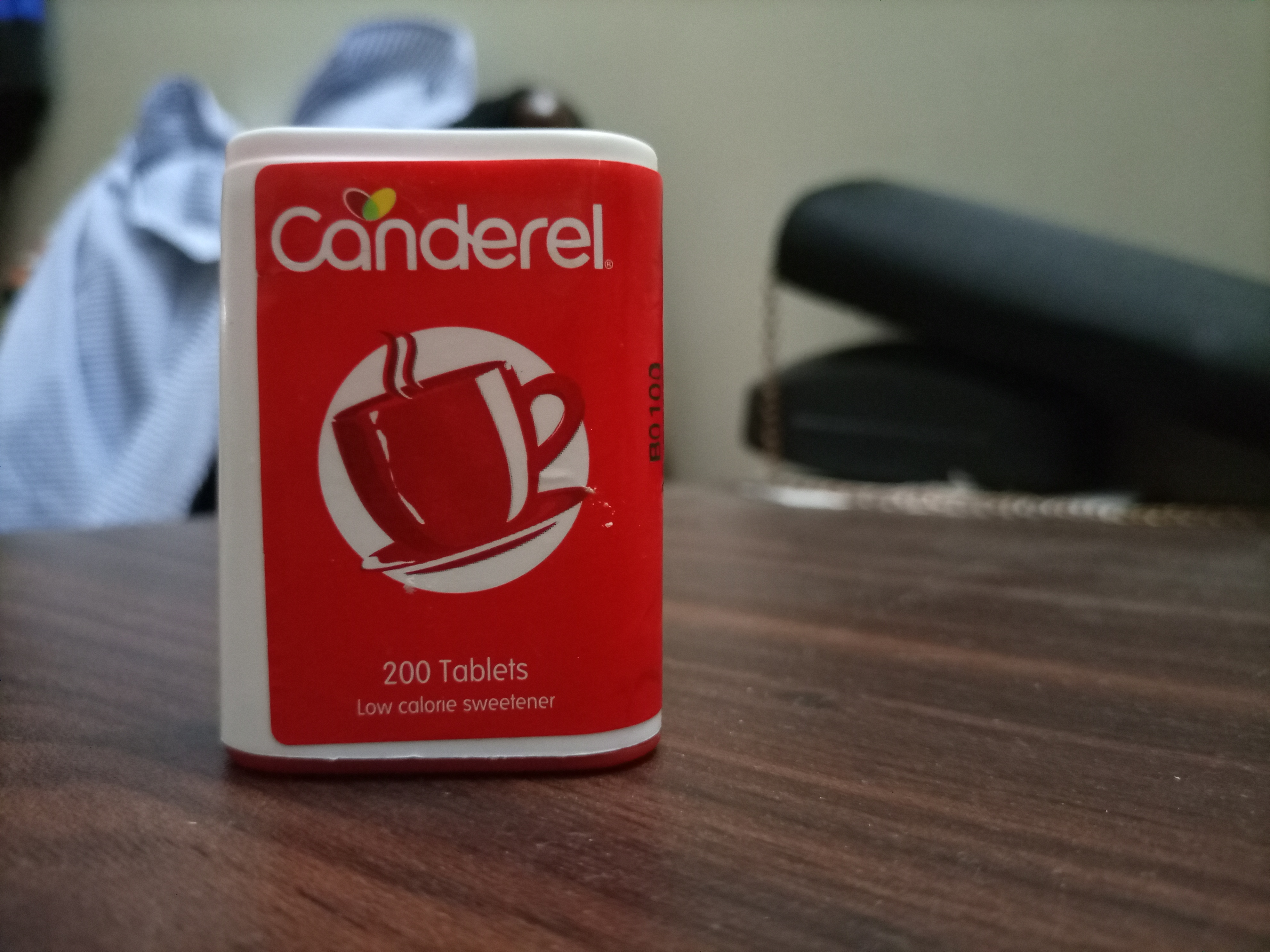 An artificial sweetener container on a table | Source: Shutterstock
