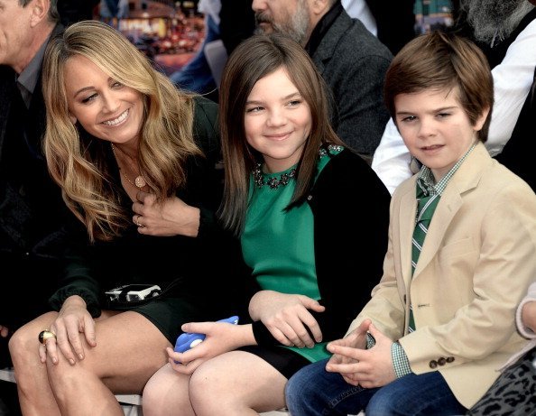 Christine Taylor and her children Ella Stiller and Quinlin Stiller watch as actor Ben Stiller is honored with a hand and footprint ceremony at the TCL Chinese Theatre on December 3, 2013, in Los Angeles, California. | Source: Getty Images.