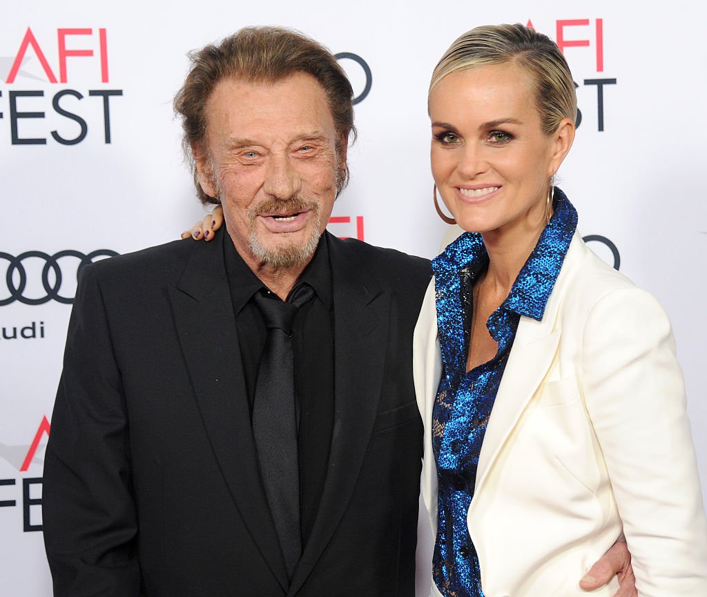 Singer Johnny Hallyday and actress/wife Laeticia Hallyday arrive at AFI FEST 2016 Presented By Audi - Opening Night - Premiere At 20th Century Fox's 