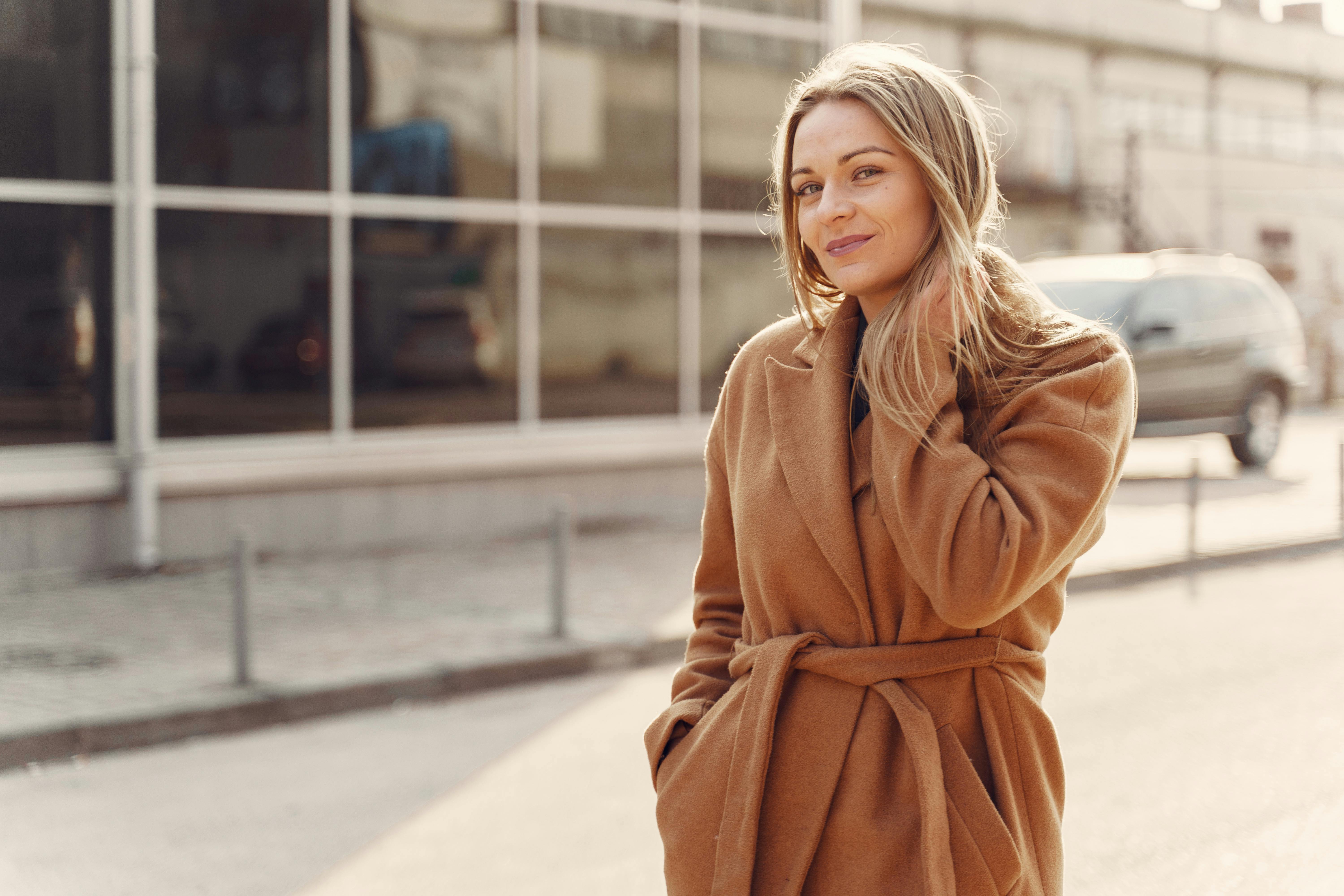 A woman in a camel-colored coat | Source: Pexels