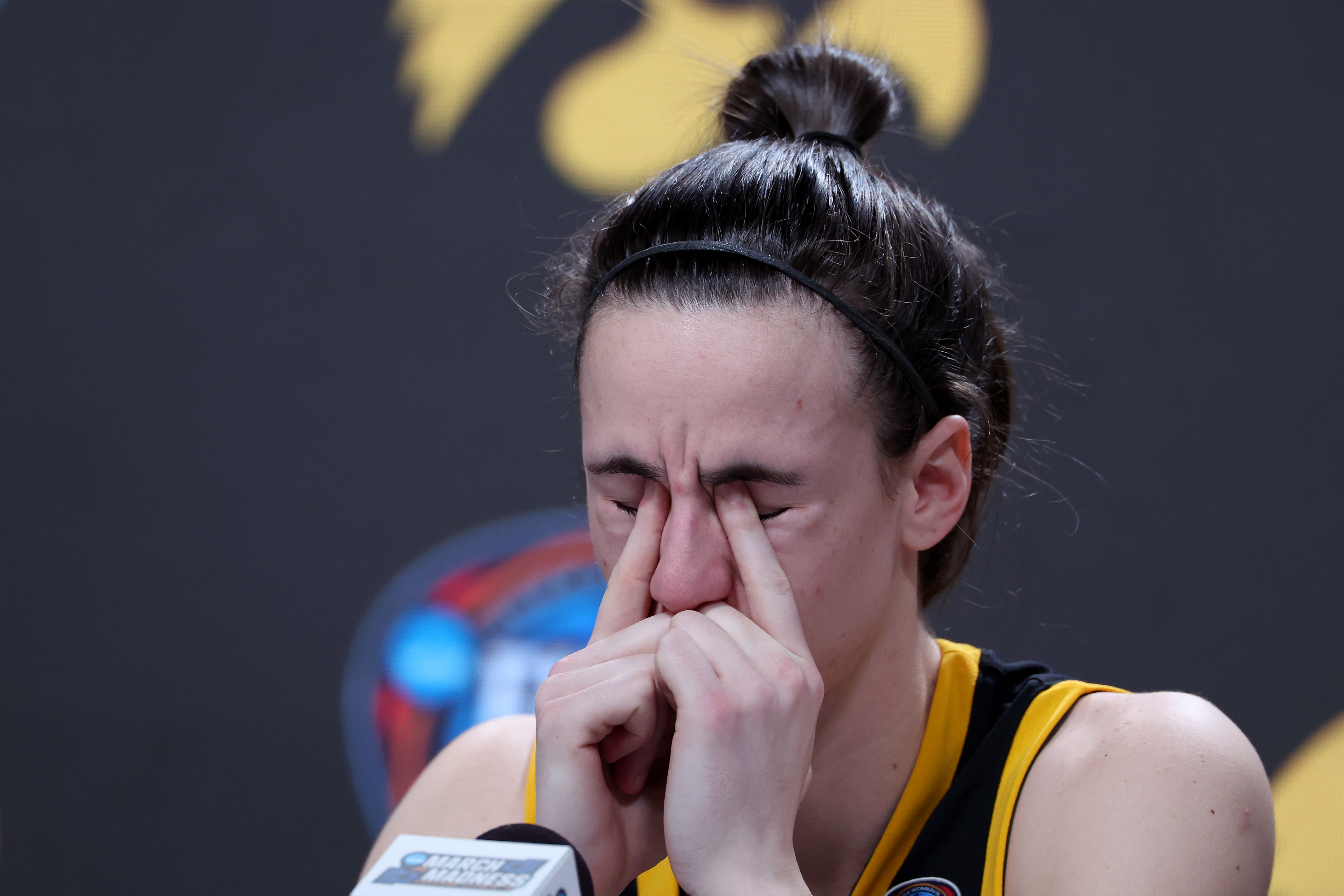 Caitlin Clark of the Iowa Hawkeyes reacts as she speaks to the media after losing to the South Carolina Gamecocks in the 2024 NCAA Women's Basketball Tournament National Championship in Cleveland, Ohio, on April 7, 2024. | Source: Getty Images