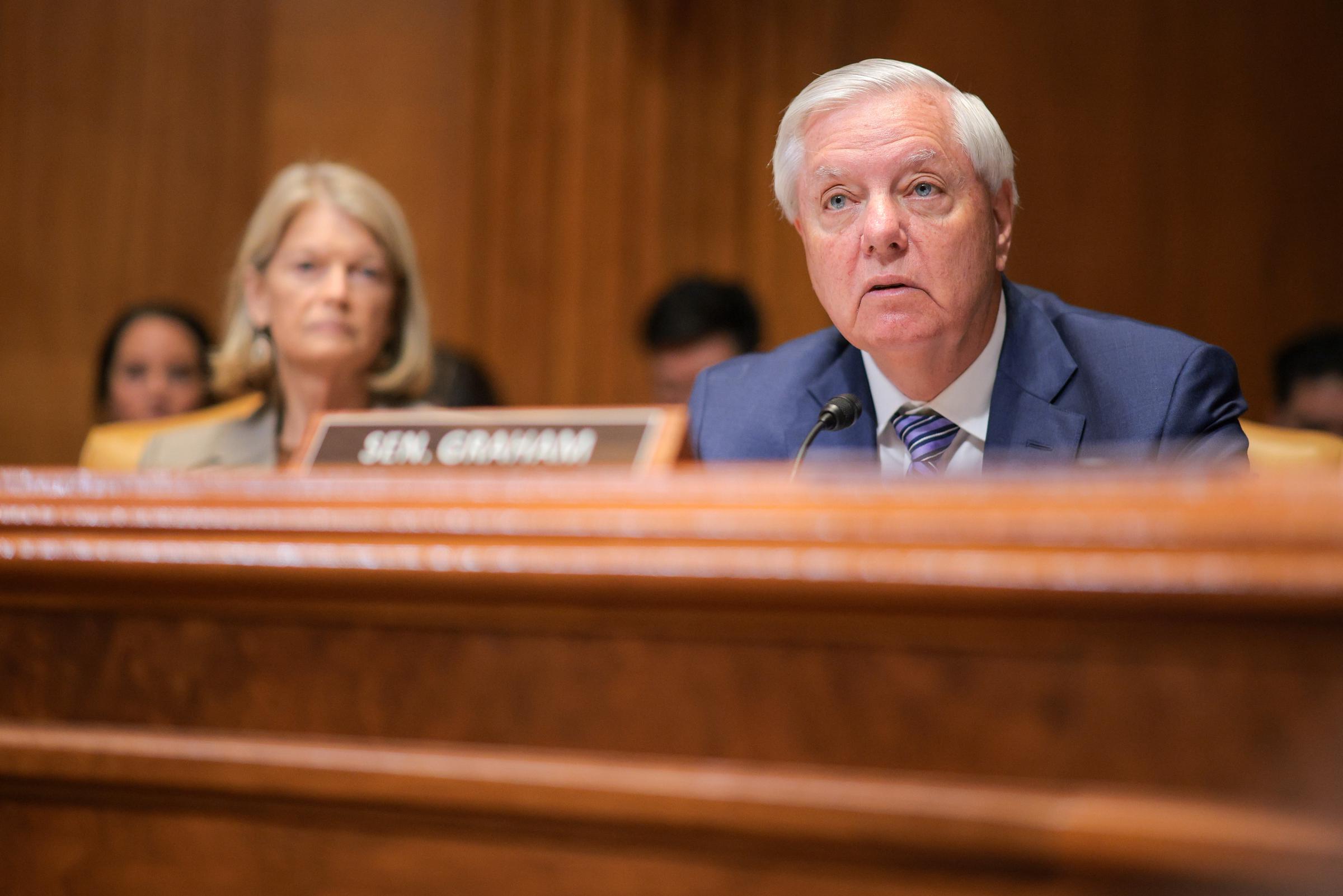 Seated before the Senate Appropriations Committee, Lindsey Graham listens intently before speaking during a budget hearing, focusing on federal spending priorities as lawmakers review the administration's funding request. | Source: Getty Images