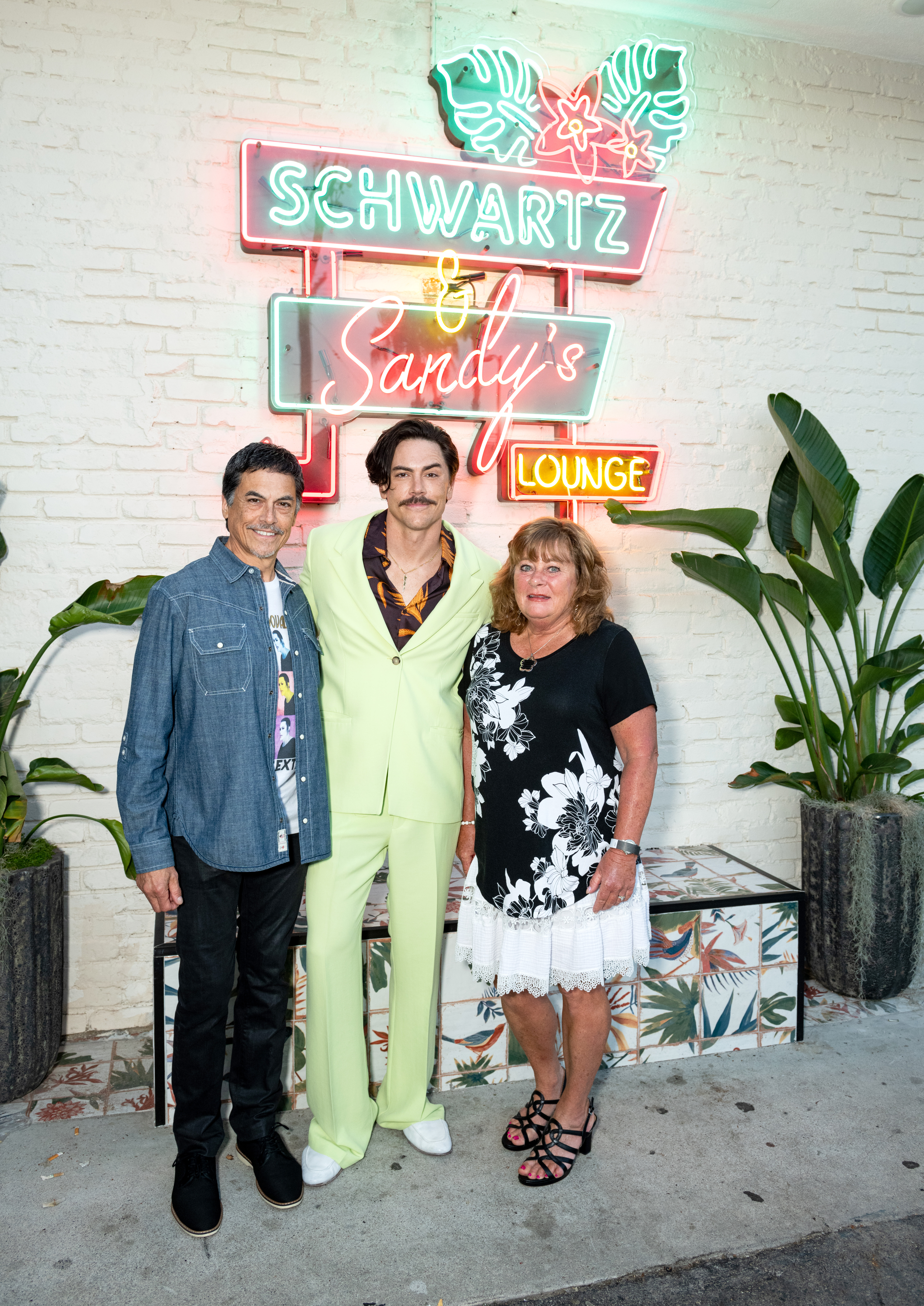 Tom Sandoval and his parents Tony Sandoval and Terri Green attend the Friends and Family Opening at Schwartz & Sandy's with the cast of "Vanderpump Rules" at Schwartz & Sandy's Lounge on July 26, 2022, in Los Angeles, California. | Source: Getty Images