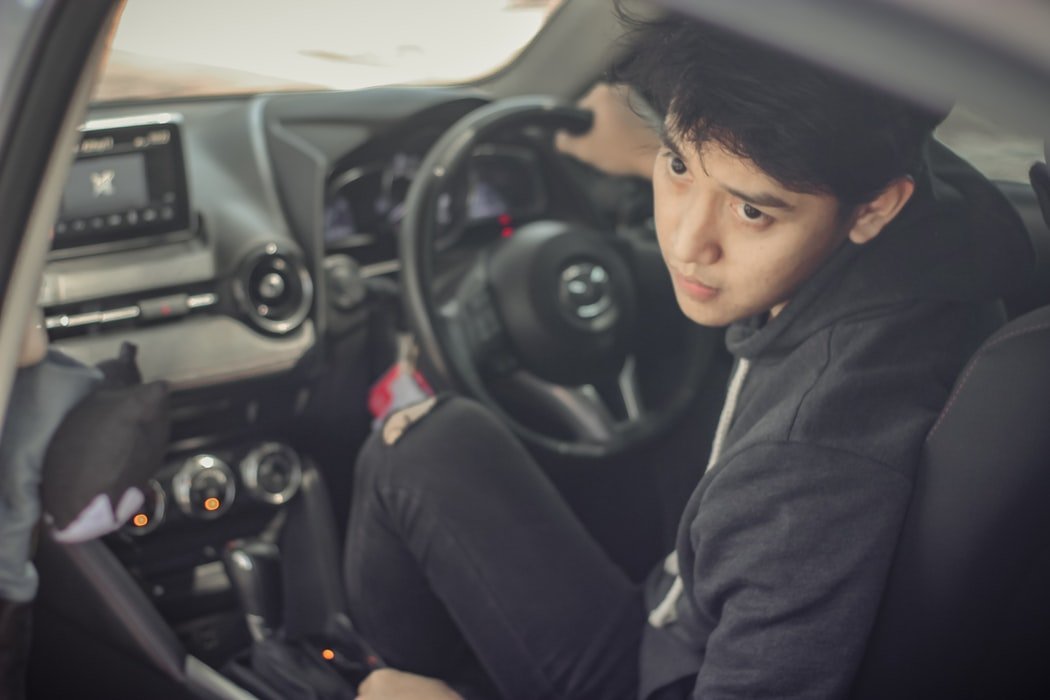 A young man inside a car. | Source: Unsplash