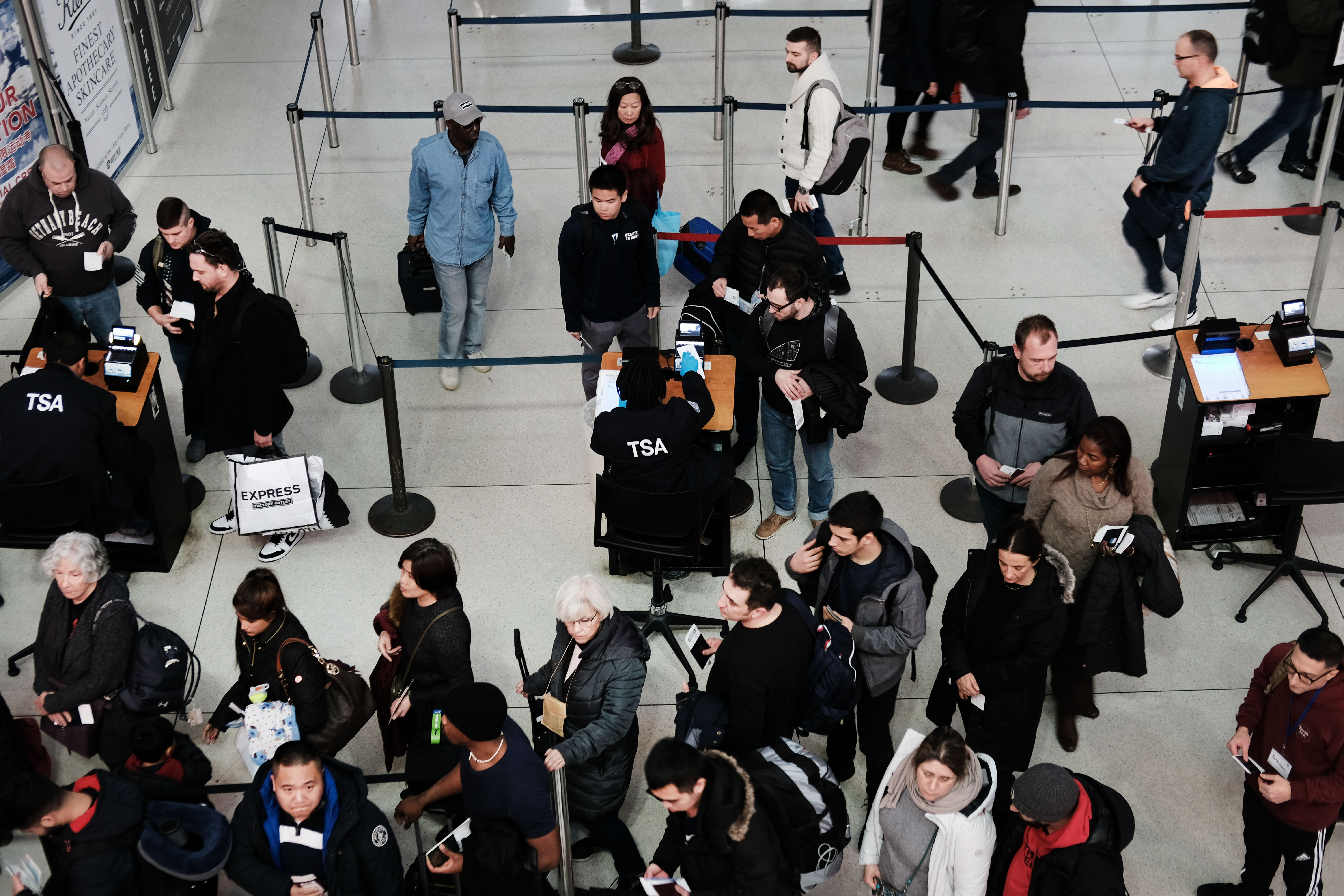Passengers waiting for their luggage to be checked by TSA at the JFK Airport in New York City | Photo: Getty Images
