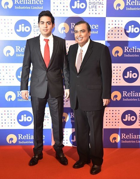 Mukesh Ambani and Akash at the 42nd AGM of Reliance Ind. Ltd in Mumbai, India. | Photo: Getty Images