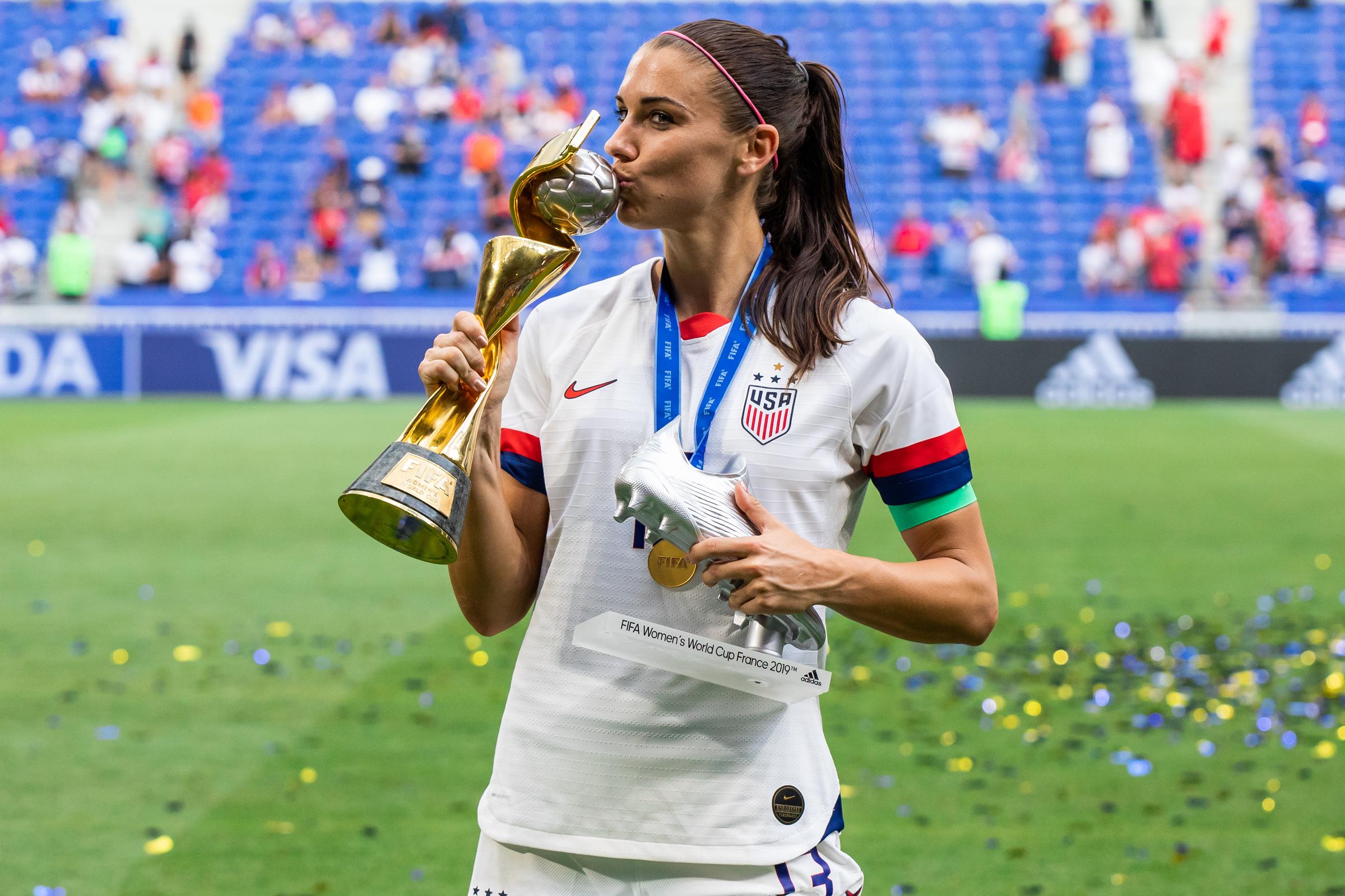 Alex Morgan celebrating with a trophy and the second-best scorer in the tournament award after the 2019 FIFA Women's World Cup Final match between The United States of America and The Netherlands at Stade de Lyon, on July 7, 2019. | Source: Getty Images