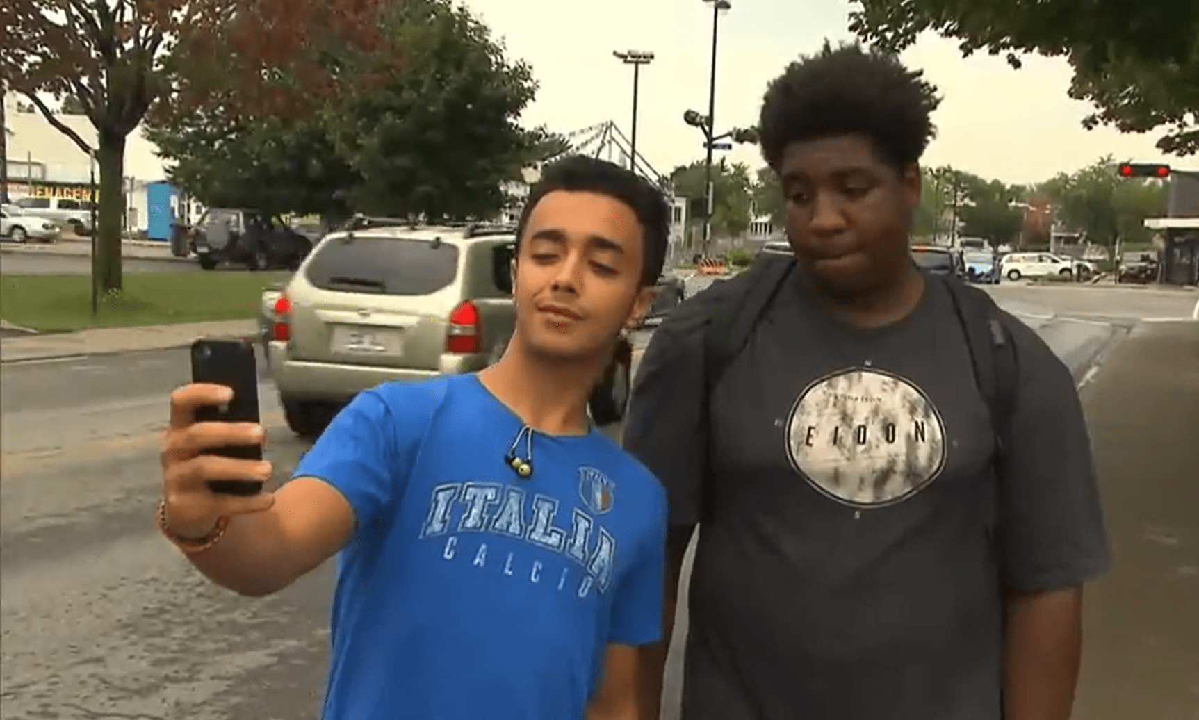 An individual taking a selfie with Malyk Bonnet.│ Source: CBC News: The National 