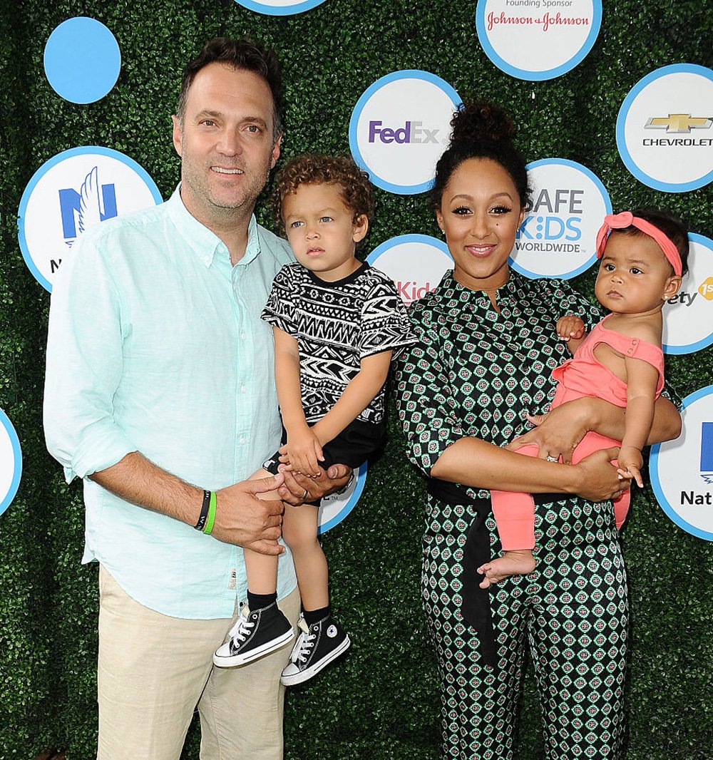 Adam Housley, Tamera Mowry, and their children, Aden and Ariah attend Safe Kids Day at Smashbox Studios Culver City, California in April 2016. I Image: Getty Images.
