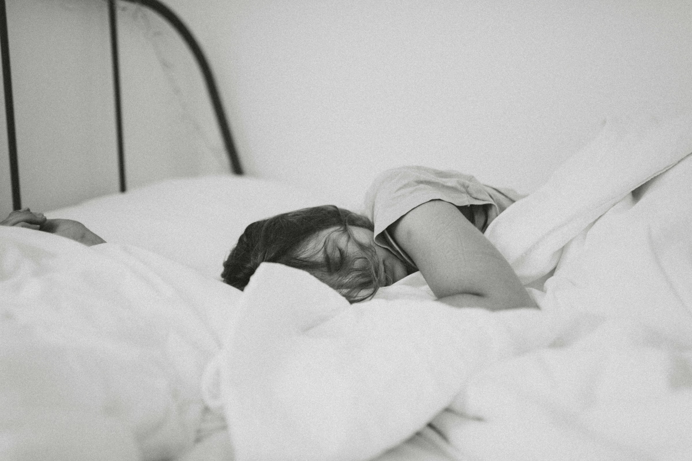 A woman sleeping in her bed | Source: Unsplash