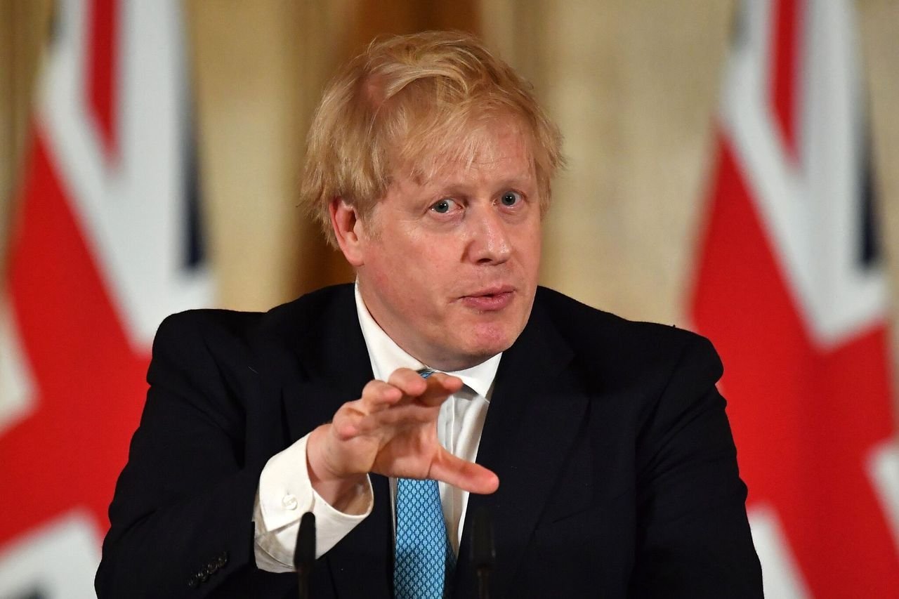 British Prime Minister Boris Johnson gestures as he speaks during a coronavirus news conference inside number 10 Downing Street on March 19, 2020 in London, England | Photo: Getty Images
