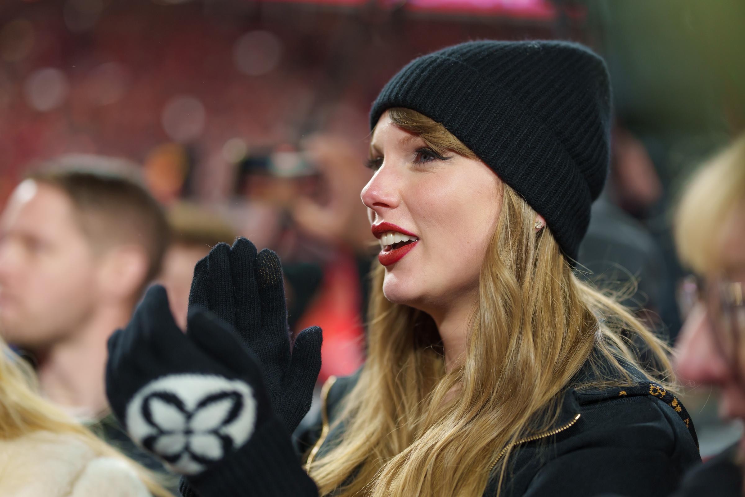 Taylor Swift watching the trophy presentation after the AFC Championship NFL football game | Source: Getty Images