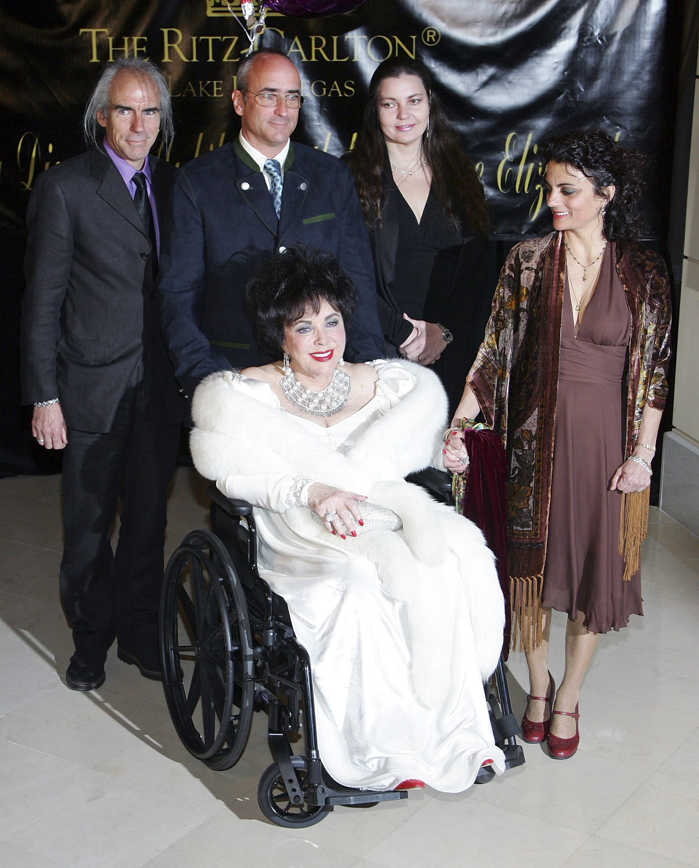 Elizabeth Taylor attends her 75th birthday party with her children (L-R) Michael Wilding Jr., Christopher Wilding, Maria Burton, and Liza Todd at the Ritz-Carlton, Lake Las Vegas on February 27, 2007, in Henderson, Nevada. | Source: Getty Images
