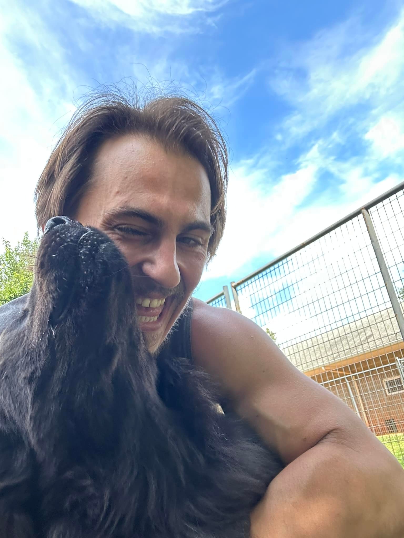 Adam Turck poses with his dog in a photo shared on September 14, 2023. | Source: Facebook/Adam Turck