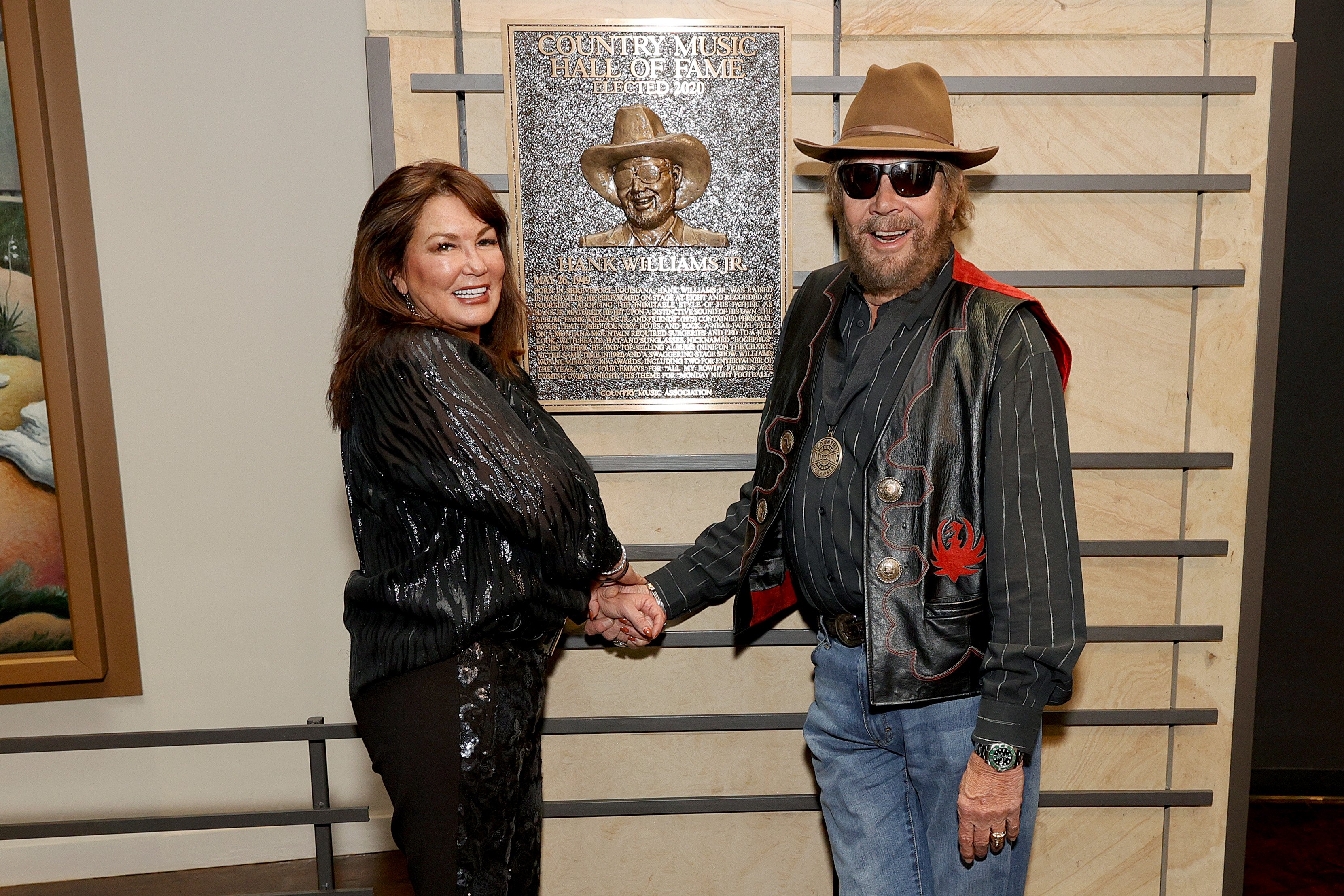 Mary Jane Thomas and 2020 inductee Hank Williams Jr. seen during the 2021 Medallion Ceremony, celebrating the Induction of the Class of 2020 at Country Music Hall of Fame and Museum on November 21, 2021 in Nashville, Tennessee | Source: Getty Images