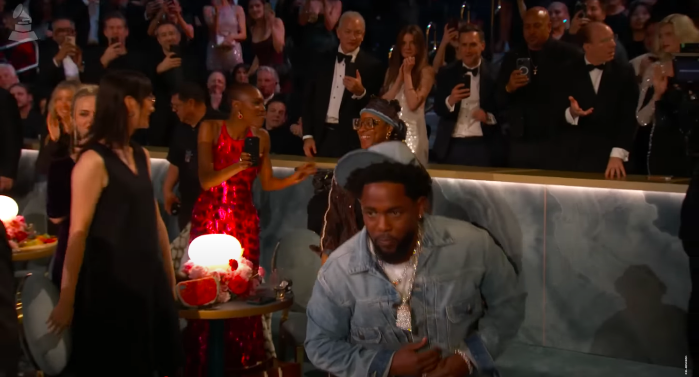 Kendrick Lamar making his way to the stage to receive his Grammy for Record of the Year, as the audience claps for him, posted on February 3, 2025. | Source: YouTube/Recording Academy/Grammys