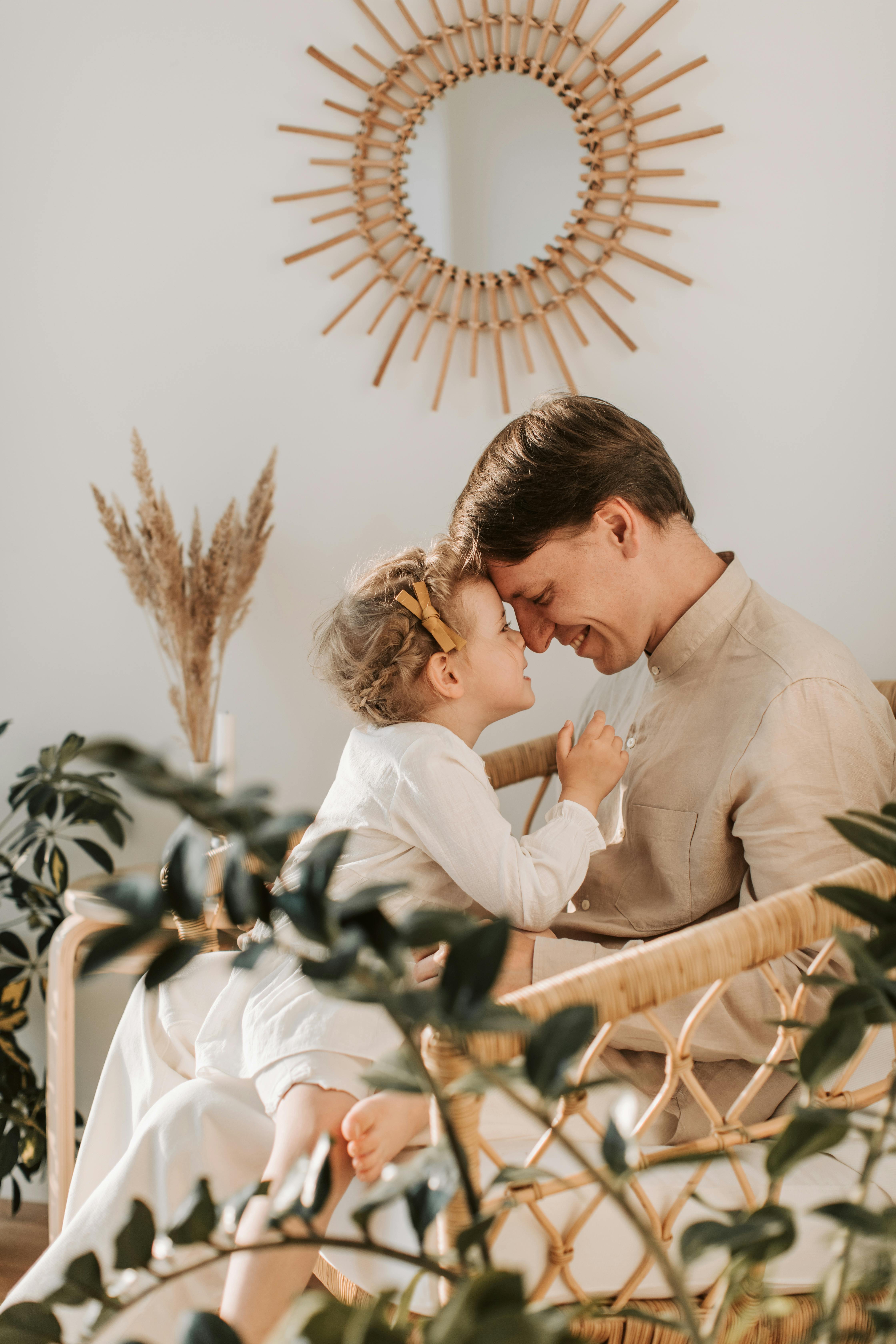 Young man with his small daughter | Source: Pexels