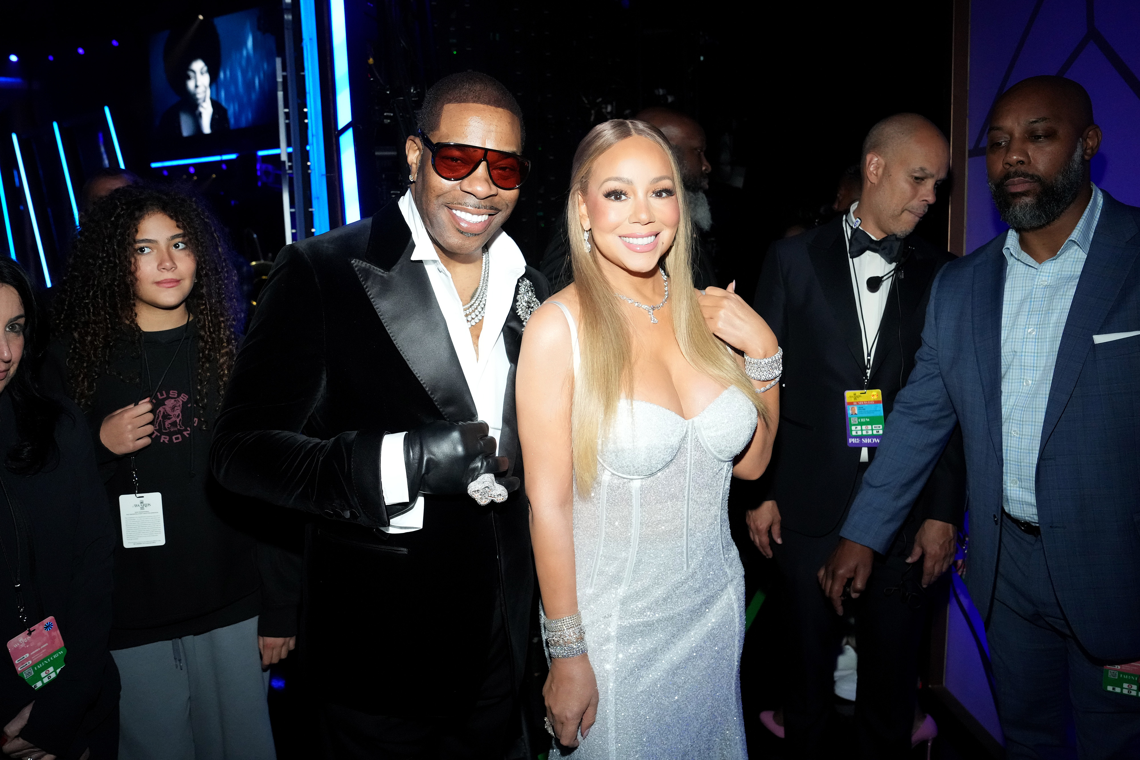 After receiving the award, Carey poses backstage with Rhymes, creating a keepsake photo that will forever remind them, and others, of this unforgettable occasion.