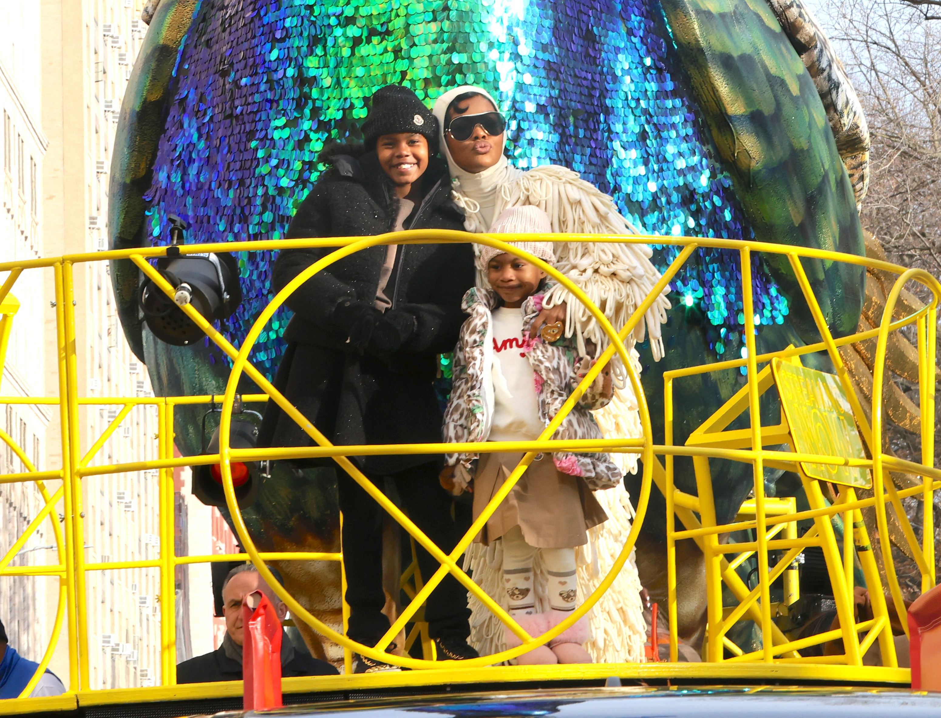 Teyana Taylor is seen with daughters Iman "Junie" Tayla Shumpert Jr. and Rue Rose Shumpert at the 99th Macy's Thanksgiving Day Parade on November 27, 2025, in New York City | Source: Getty Images