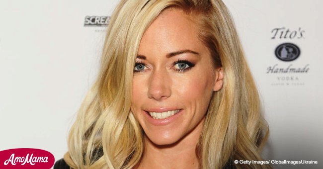 Kendra Wilkinson showcases her washboard abs in a tiny sports bra