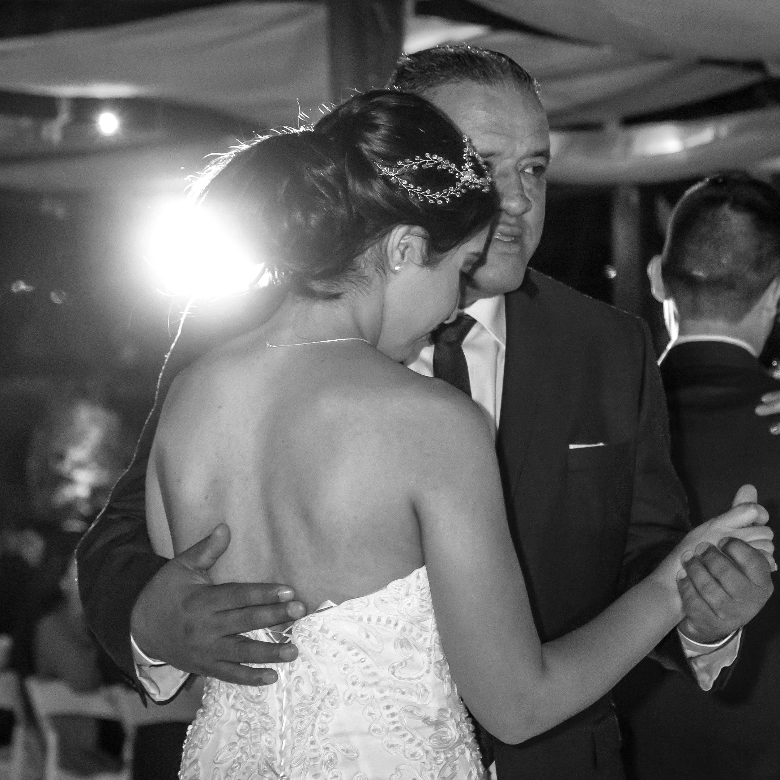 A bride dances with an elderly man at a wedding reception | Source: Pexels