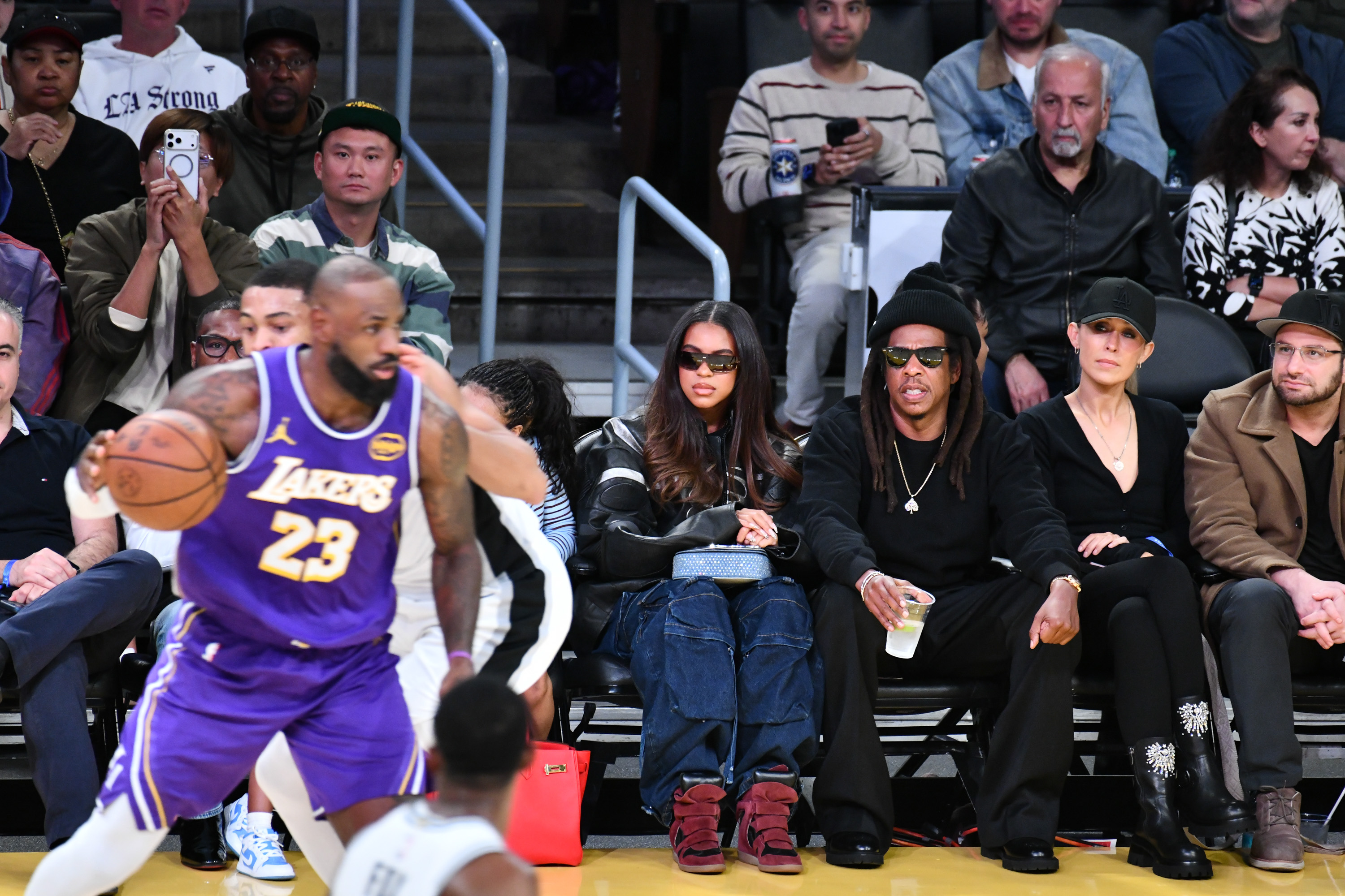 LeBron James, Blue Ivy Carter, and Jay-Z at the game between the Los Angeles Lakers and San Antonio Spurs at Crypto.com Arena in Los Angeles, California, on December 10, 2025 | Source: Getty Images