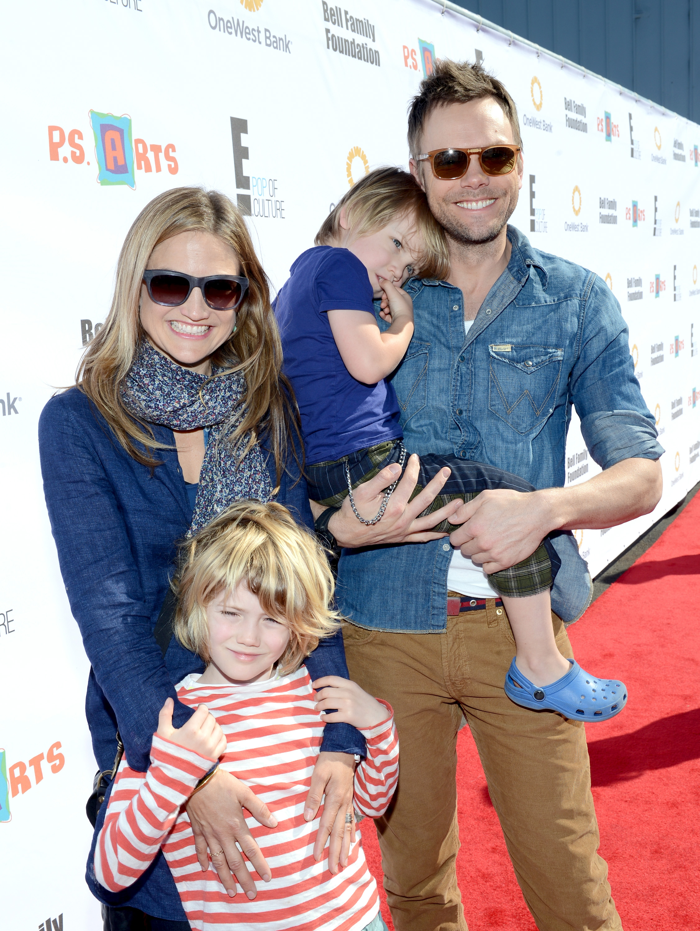 Sarah Williams and Joel McHale with their sons Edward Rory and Isaac McHale attend the creative arts fair and family day "Express Yourself,"  supporting P.S. ARTS, at Barker Hangar on November 11, 2012, in Santa Monica, California. | Source: Getty Images