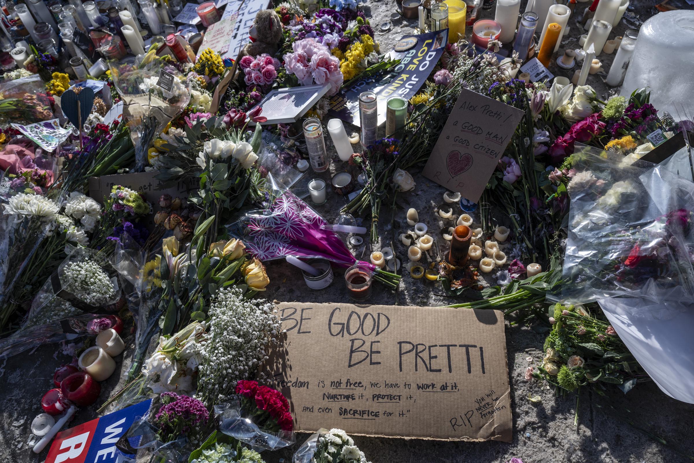 Flowers and signs are placed at a memorial for Alex Pretti in Minneapolis on January 26, 2026 | Source: Getty Images