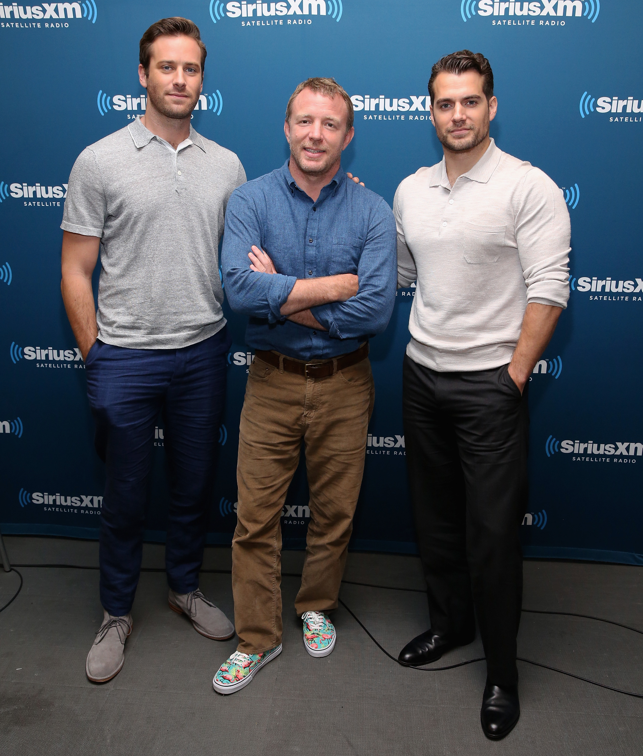 Armie Hammer, Guy Ritchie, and Henry Cavill pose during SiriusXM's Entertainment Weekly Radio on August 12, 2015, in New York City | Source: Getty Images