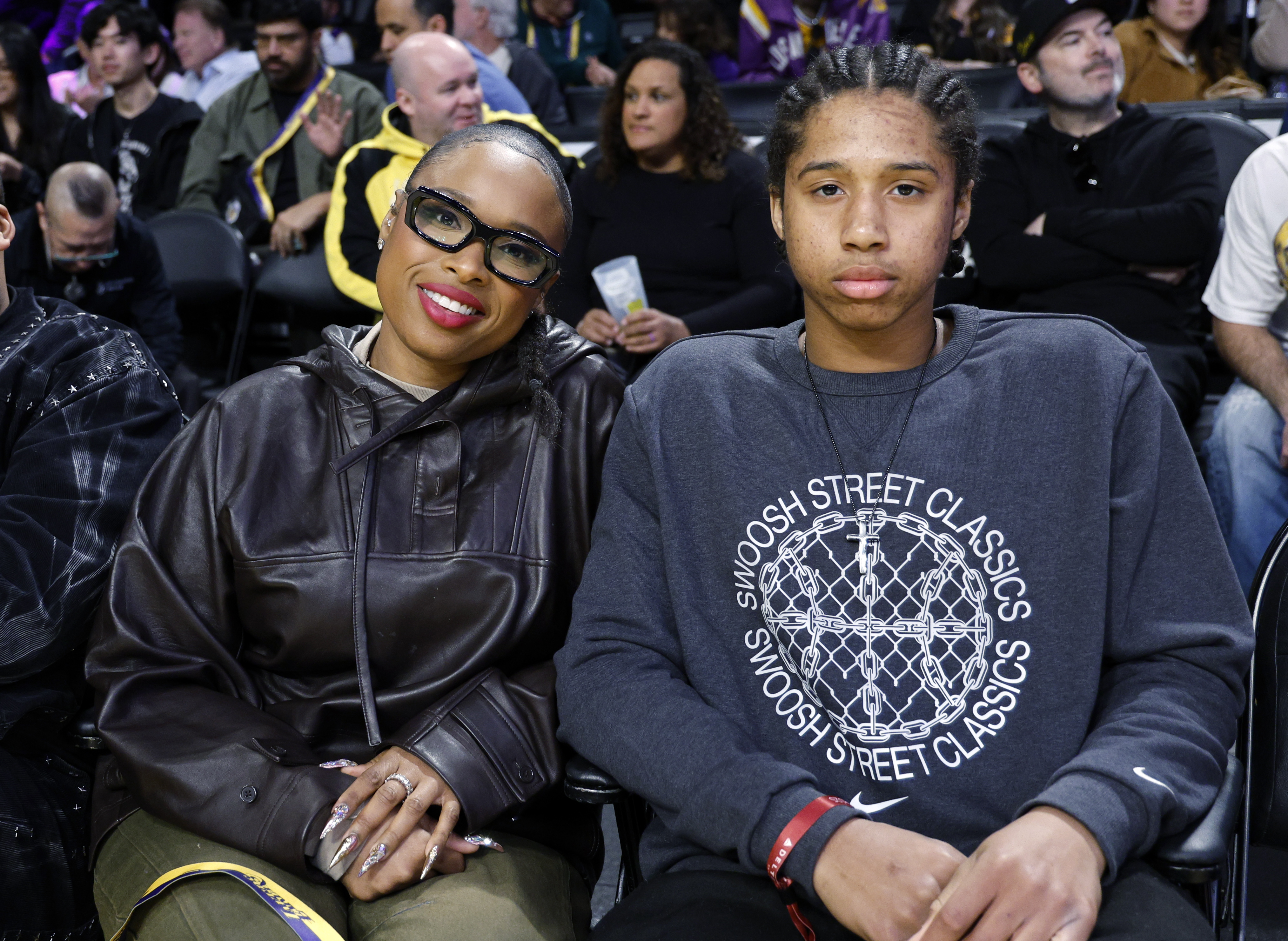 Jennifer Hudson and her son, David Daniel Otunga Jr., attend a Los Angeles Lakers game in California, on February 8, 2025 | Source: Getty Images